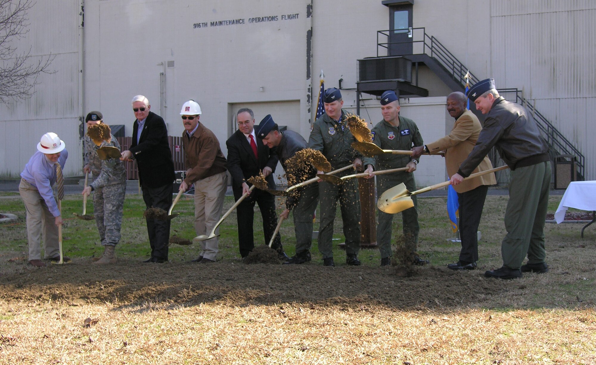 SEYMOUR JOHNSON AIR FORCE BASE, N.C. -- With gold shovels in hand members of the 916th Air Refueling Wing, 4th Fighter Wing, Daniels and Daniels Construction Co. and local government officials break ground for the three new buildings for the 916th ARW.  The buildings will consist of a squadron operations building, a smimulator building and a corrosion-control hangar to be completed by June 2009.  U. S. Air Force photo/Ms. Donna Lea