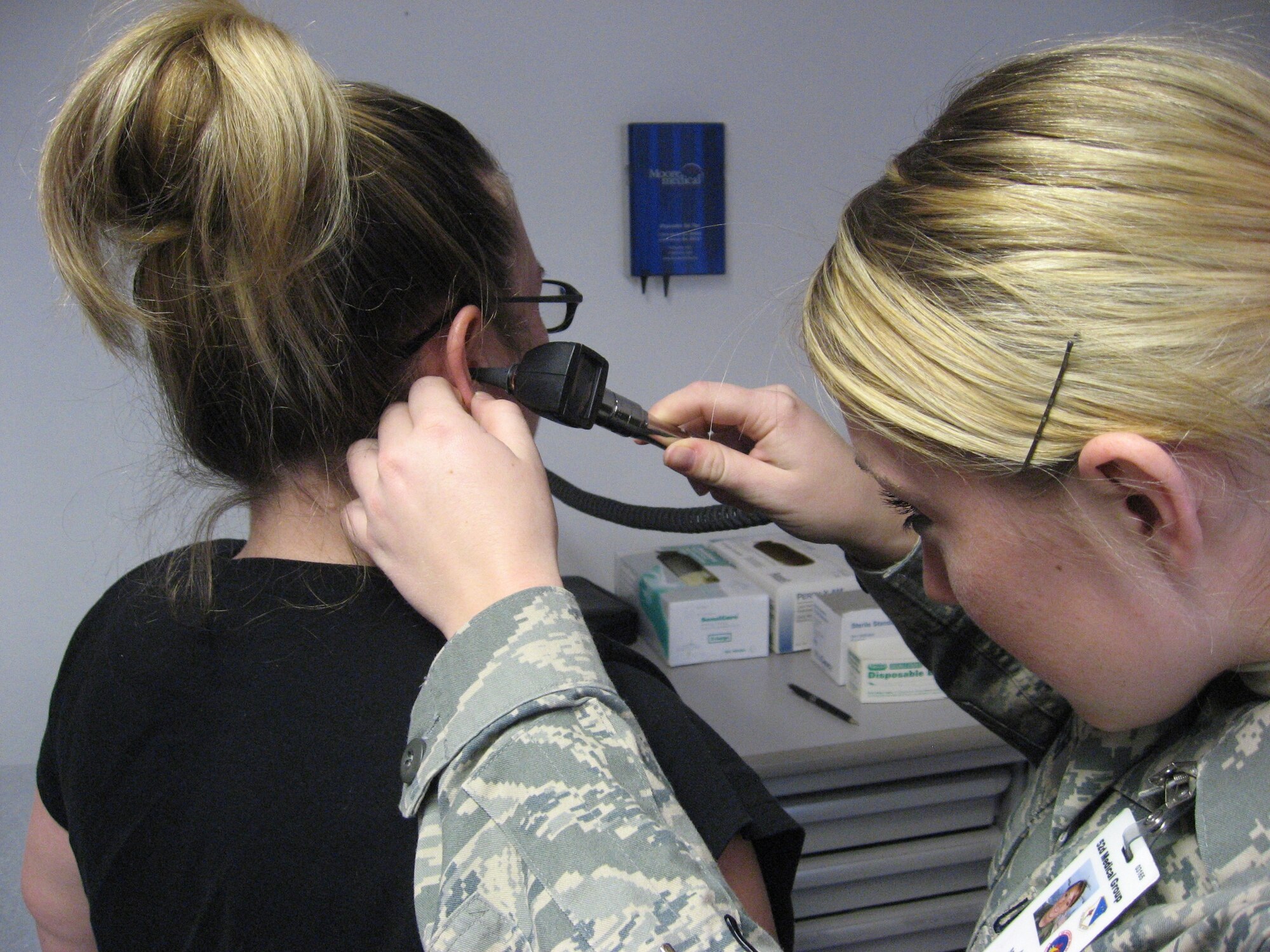 SPANGDAHLEM AIR BASE, Germany – Airman 1st Class Macey Miller, 52nd Aerospace Medicine Squadron medical technician, examines a patient’s ears. Airman Miller is a flight medicine medical technician. (U.S. Air Force photo/Master Sgt. Gregory Reece)