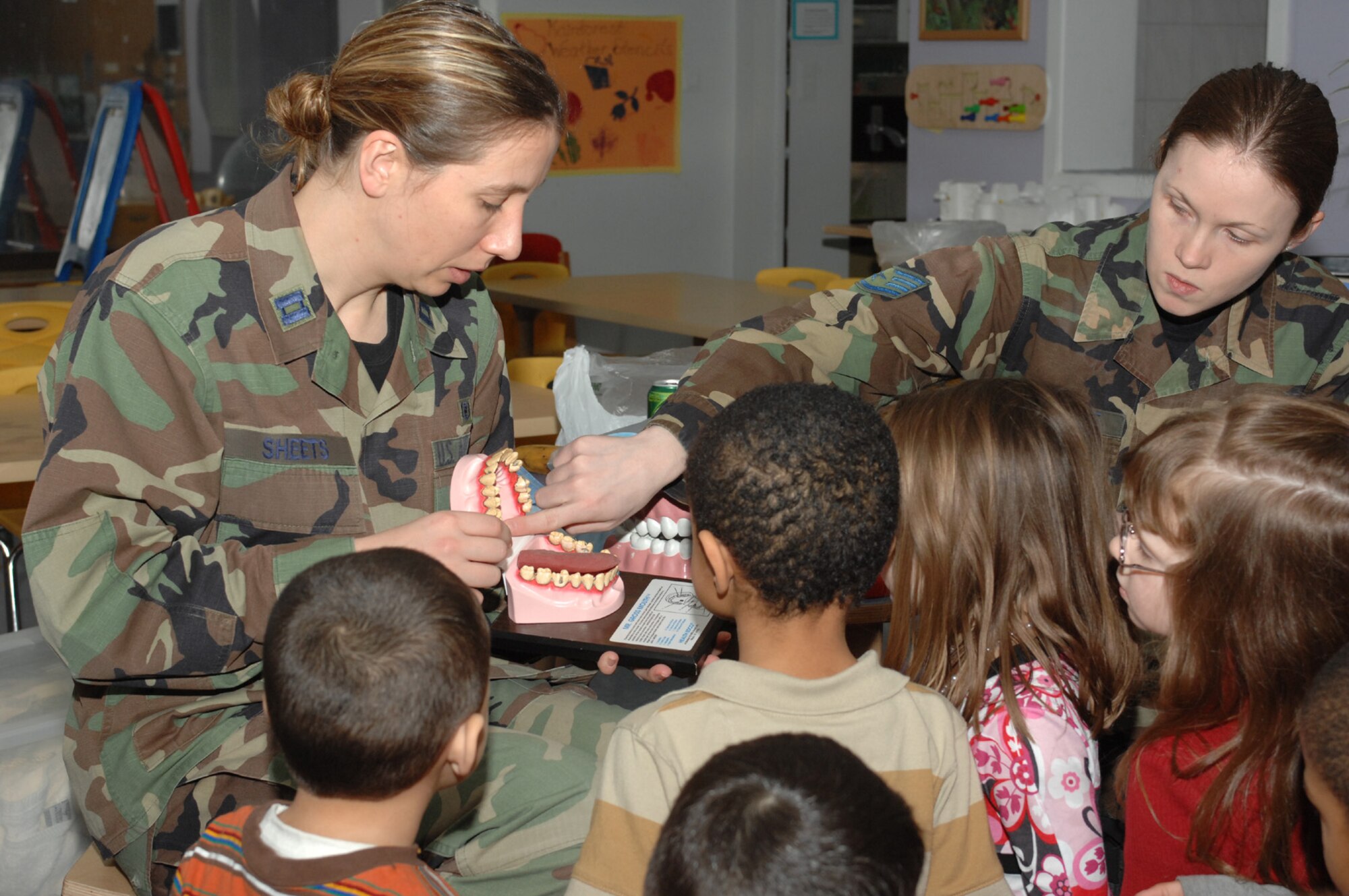 SPANGDAHLEM AIR BASE, Germany – Capt. Christina Sheets and Staff Sgt. Jennifer Greene, both from the 52nd Dental Squadron, show preschoolers what unhealthy teeth look like during a demonstration at the Children's Development Center for Children's Dental Health Month Feb. 5, 2008. (U.S. Air Force photo/Senior Airman Kristin Ruleau)