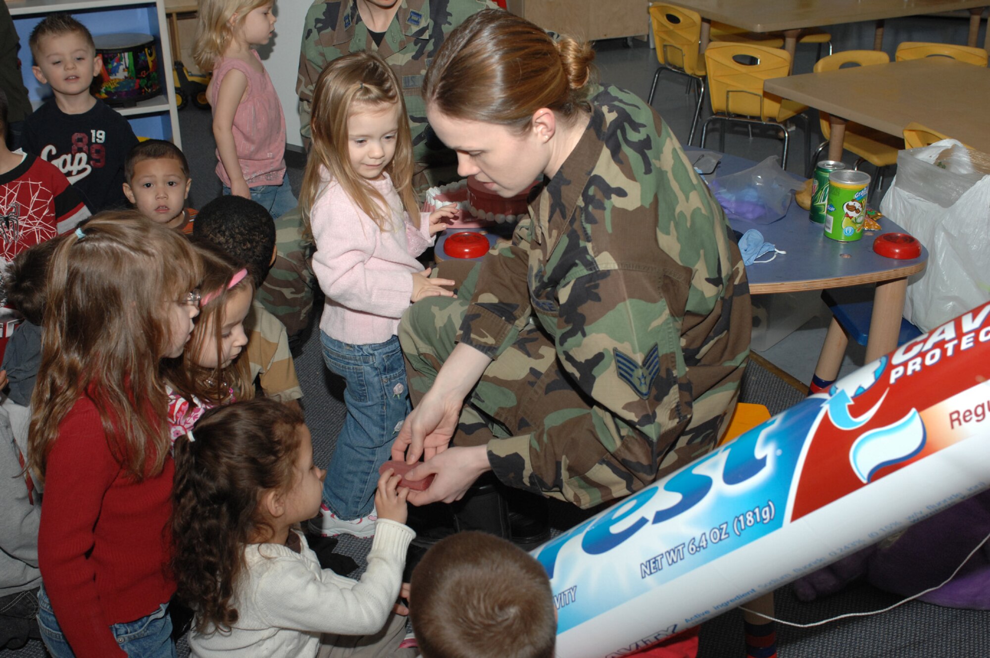 SPANGDAHLEM AIR BASE, Germany -- Staff Sgt. Jennifer Greene, 52nd Dental Squadron, shows preschoolers what a healthy tongue should look like during a demonstration at the Children's Development Center for Children's Dental Health Month Feb. 5, 2008. (U.S. Air Force photo/Senior Airman Kristin Ruleau)