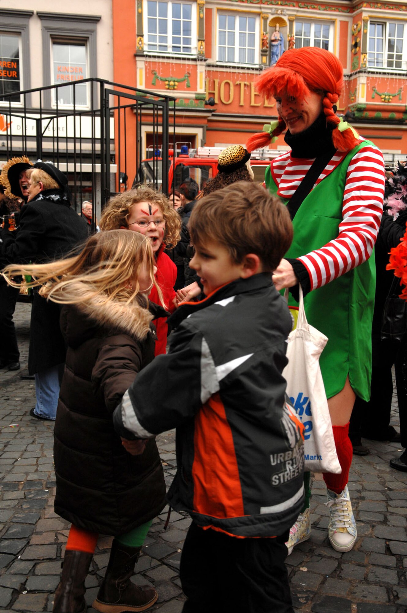 SPANGDAHLEM AIR BASE, Germany -- Local schoolchildren dance in the marktplatz as a band plays traditional fasching music at Weiberdonnerstag (Women’s Thursday) in Wittlich, Jan. 31, 2008. Fasching is a time for celebration before the start of Lent and Weiberdonnerstag is the official start of the carnival-like festival. (U.S. Air Force photo/Senior Airman Matthew S. Bright)