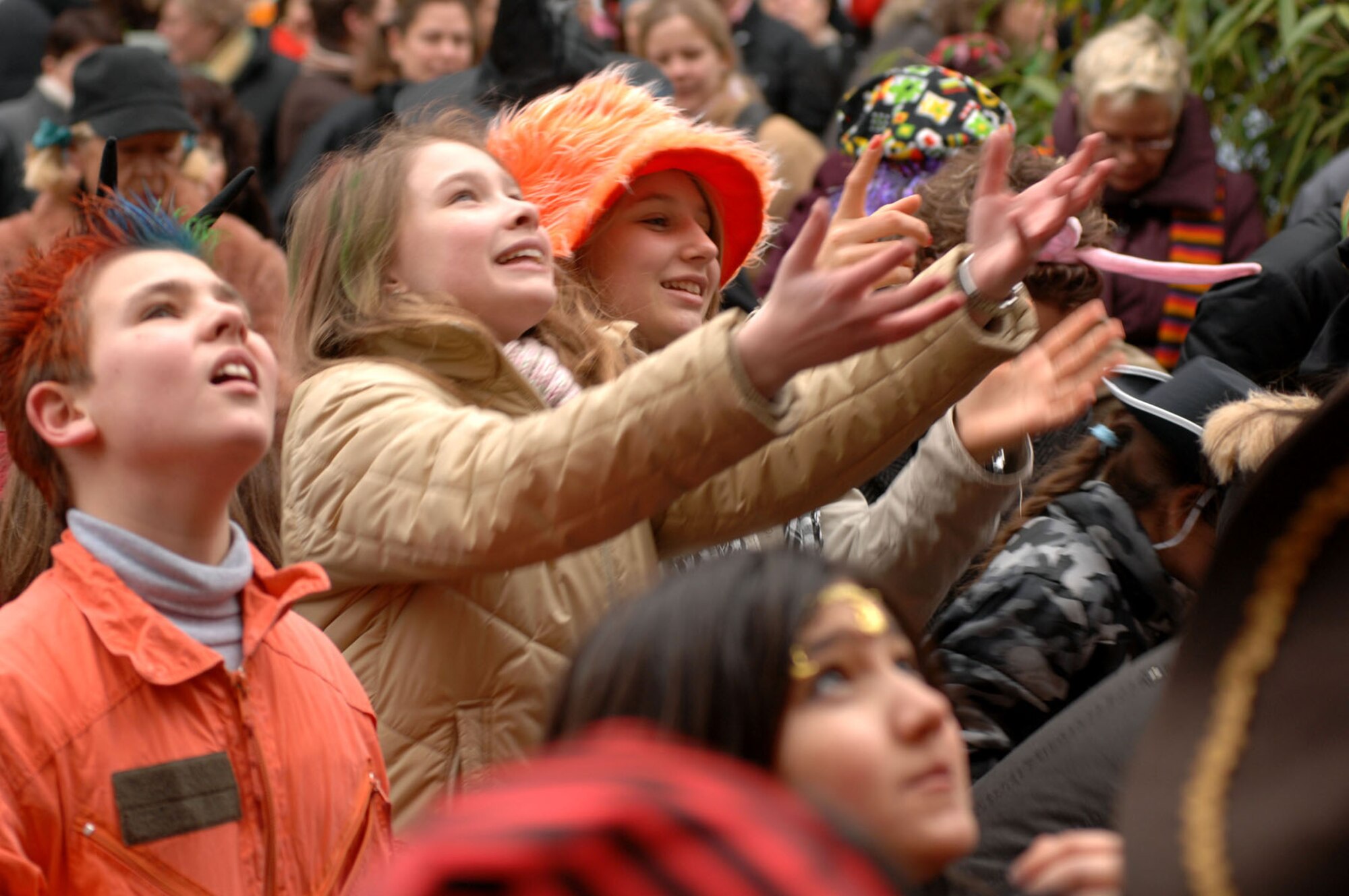 SPANGDAHLEM AIR BASE, Germany -- Children wrestle elbow to elbow for sweets thrown from the Rathaus windows during Weiberdonnerstag (Women’s Thursday) festival in Wittlich, Jan. 31, 2008. As part of the Weiberdonnerstag traditions, the women of German cities throw treats to local children after seizing control of the keys to the city and taking the Burgermeister captive. (U.S. Air Force photo/Senior Airman Matthew S. Bright)