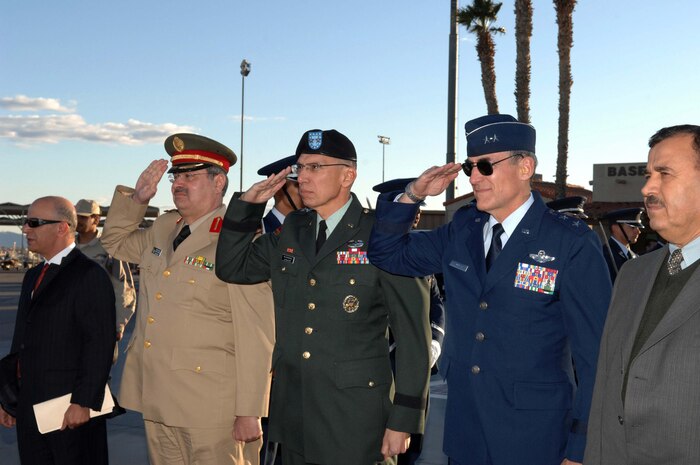 NELLIS AIR FORCE BASE, Nev.—(From left to right) Lt. Gen. Abdul Rahman Bin Fahad Al-Faisal, Royal Saudi air force commander, Maj. Gen. Rhett Hernandez, U.S. Military Training Mission chief, and Maj. Gen. Mike Worden, United States Air Force Warfare Center commander, render salutes at the arrival of His Royal Highness Prince Khalid bin Abdul Aziz Al-Saud here Feb. 4. The prince, who is the Assistant Minister of Defense and Aviation for Military Affairs, arrived at Nellis to observe the Royal Saudi air force's participation during the ongoing Red Flag exercise. (U.S. Air Force photo by Senior Airman Larry E. Reid Jr.)