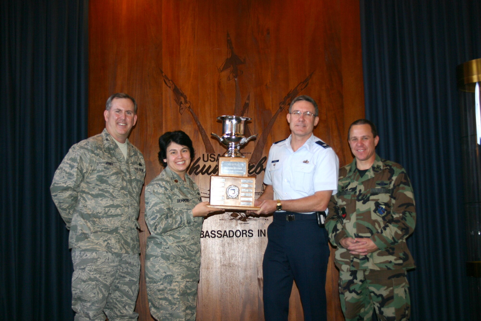 NELLIS AIR FORCE BASE, Nev.—(from left to right) Col. Stephen Jones, Air Combat Command Manpower Personnel Services deputy director, Maj. Beth Demmons, 99th Services Squadron commander, Col. Kenneth Keskel, 99th Air Base Wing vice commander, and Col. Greg Dodson, 99th Mission Support Group commander, pose with the 2008 Air Combat Command General Curtis E. LeMay Services Award here Jan. 25. This marks the third time in fours years that the 99th SVS has captured the award. (Courtesy photo)