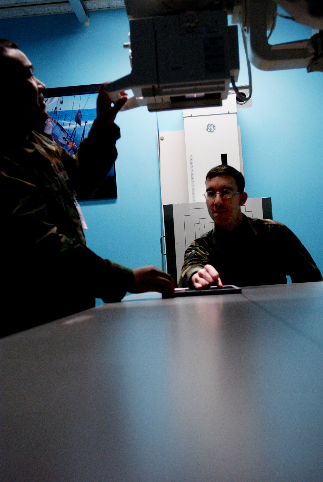 Diagnostic Imaging Technicians'  U.S Air Force Staff Sgt Rutherford Alejo (left) and Staff Sgt Joseph Moody (right) demonstrates how a hand and wrist is positioned before the hand is x-rayed using the anterior- posterior exposure here at Eielson Air Force Base, Alaska on Feb 5, 2008. The anterior-posterior x-ray exposure means the x-rays will pass through the patient from front to back.

(U.S Air Force photo by: Staff Sgt Eric T. Sheler)
