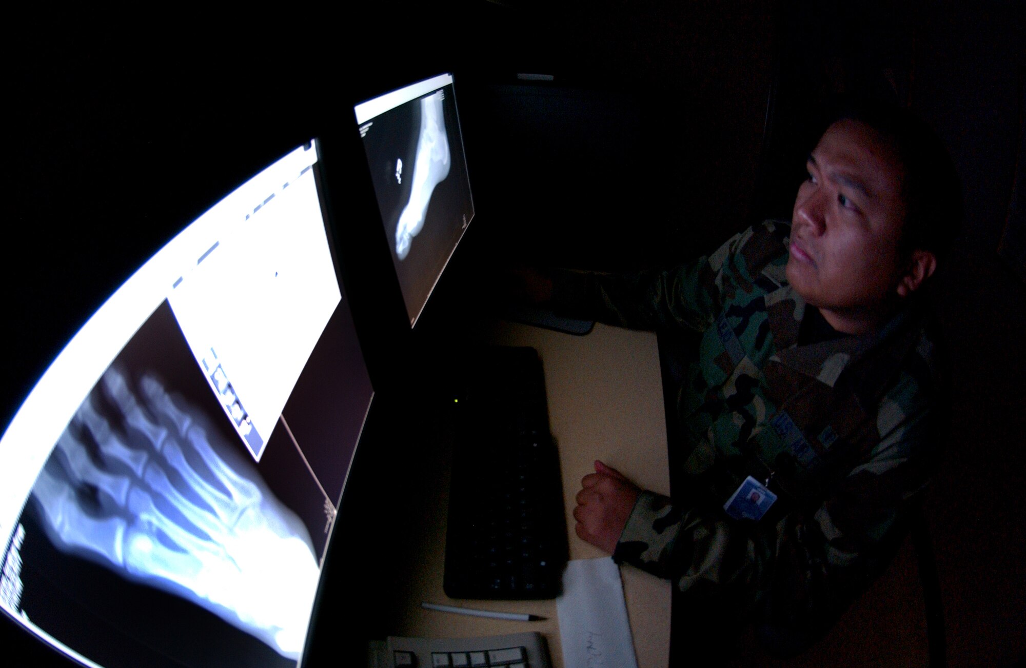 U.S Air Force Staff Sgt. Rutherford Alejo, a Diagnostic Imaging Technician assigned to the 354th Medical Group, Eielson Air Force Base, Alaska views and analyzes a processed radiograph of a foot for quality control before sending the images to the physician who requested the x-ray. Each processed radiograph is checked for correct exposure, proper position, and other items to ensure the radiograph is free from any defects and the area being examined is clear based on position and exposure so the physician can make a precise diagnosis.

(U.S Air Force photo by: Staff Sgt Eric T. Sheler)
