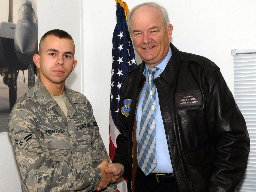 Airman 1st Class Roger Henthorn was honored by Secretary of the Air Force Michael W. Wynne Feb. 5. at the Combined Air and Space Operations Center in Southwest Asia with a personal coin. (U.S. Air Force photo/Staff Sgt. Christina M. Styer) 
