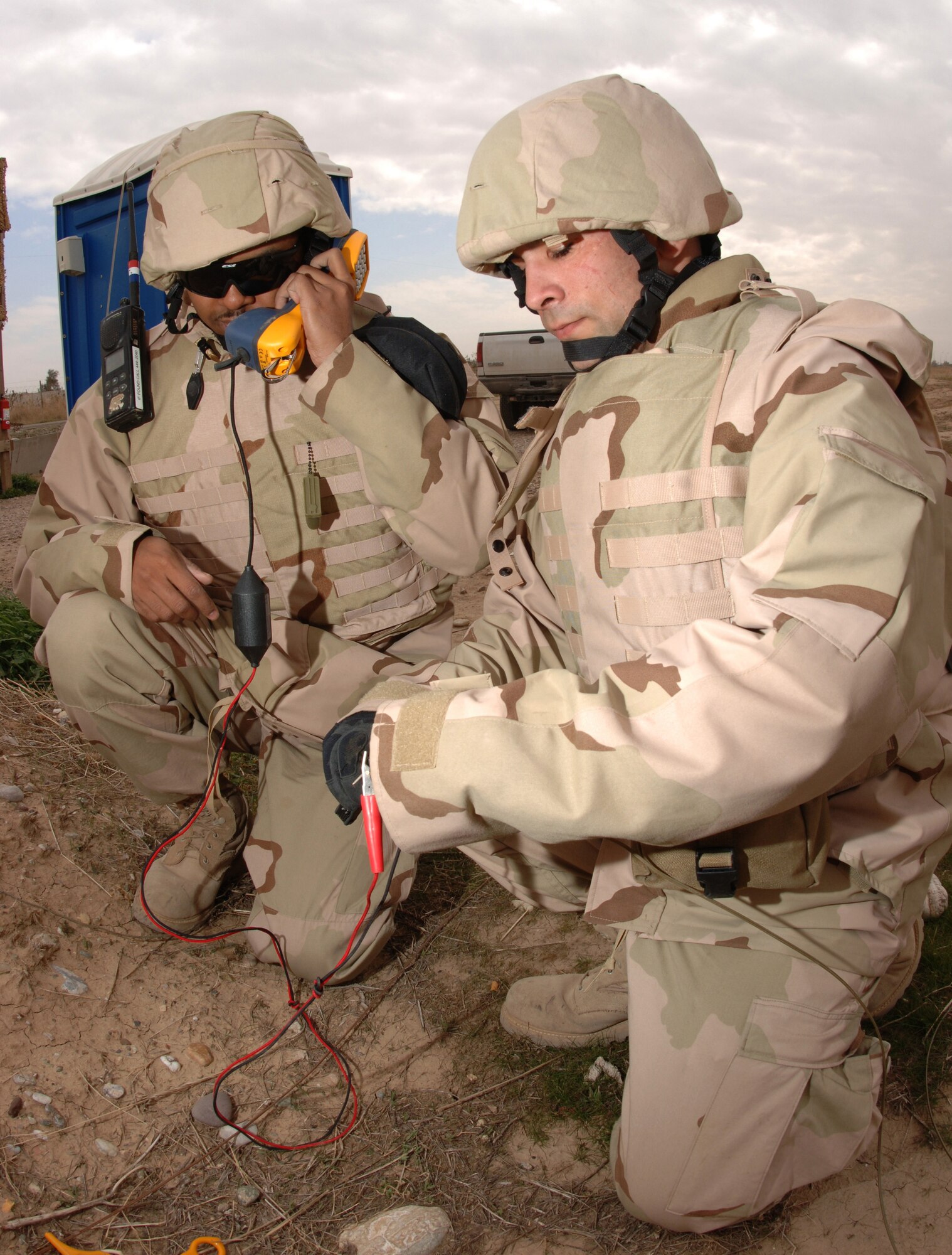 Several existing career fields in the communications and electronic warfare areas, such as voice systems technicians pictured above, are being adapted to create new ones that will meet the warfighting needs of the cyberspace domain. Teams assigned to AFCYBER (P) are developing career fields for both enlisted and officer professionals. Pictured here are Senior Airman Kenneth Hawkins and Airman 1st Class Ryan Gall who are testing cutfield wires at Kirkuk Regional Air Base, Iraq. (Photo by Senior Airman Bradley A. Lail) 