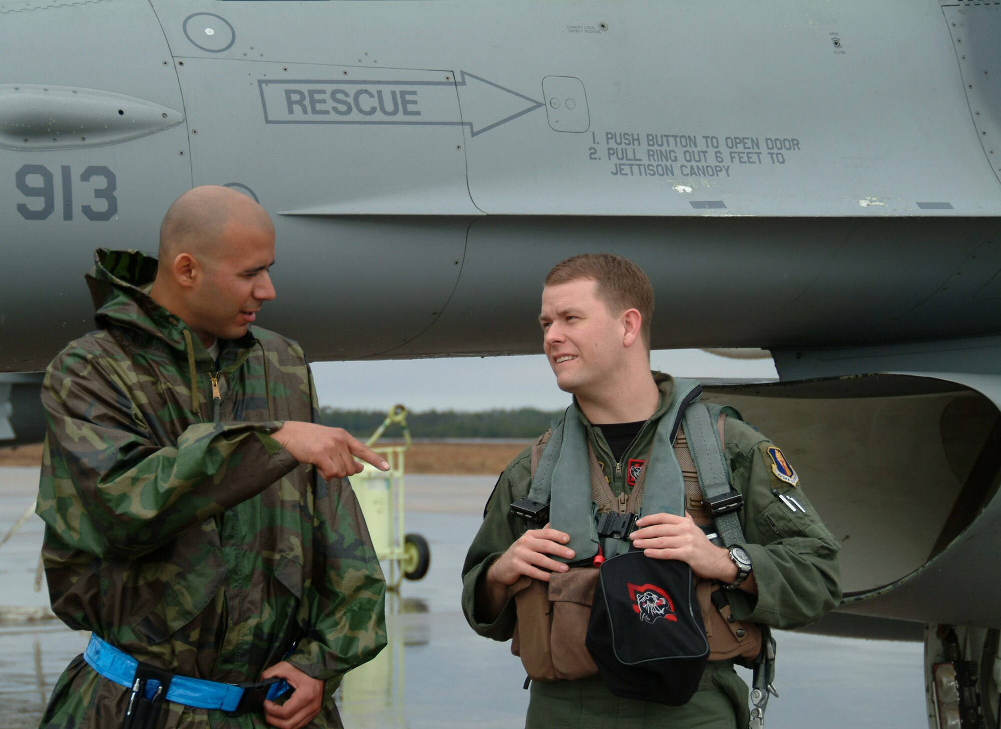 Crew Chief Staff Sgt. Pablo Jimenez, 13th Aircraft Maintenance Unit, talks with Capt. Eric Freienmuth, 13th Fighter Squadron, before his flight Feb. 5 at Eglin Air Force Base Fla.  The captain’s mission is part of the squadron’s Weapon Systems Evaluation Program commonly known as Combat Hammer.  During the mission, he will perform a scenario and fire a AGM-65, which will be recorded and analyzed by the 86th Fighter Weapons Squadron.  The data received will show if the weapon is firing properly and how the mission could be improved.  U.S. Air Force photo by Capt. Carrie Kessler.