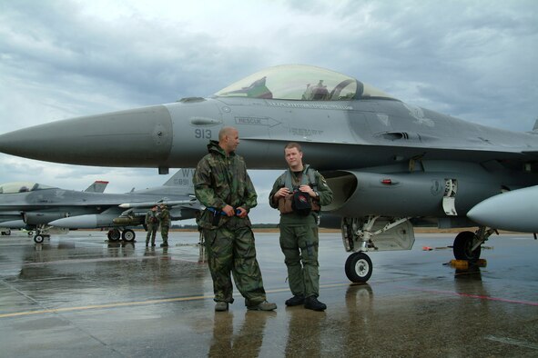 Crew Chief Staff Sgt. Pablo Jimenez, 13th Aircraft Maintenance Unit, talks with Capt. Eric Freienmuth, 13th Fighter Squadron, before his flight Feb. 5 at Eglin Air Force Base, Fla. The captain’s mission is part of the squadron’s Weapon Systems Evaluation Program commonly known as Combat Hammer. During the mission, he will perform a scenario and fire a AGM-65, which will be recorded and analyzed by the 86th Fighter Weapons Squadron. The data received will show if the weapon is firing properly and how the mission could be improved. (U.S. Air Force photo by Capt. Carrie Kessler)