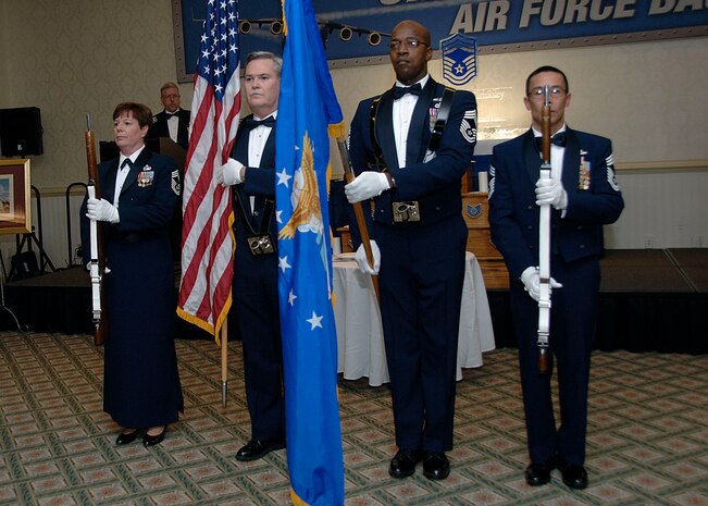 (From left) Chief Master Sgt. Denise Mikolajczyk, 437th Mission Support Squadron, Chief Master Sgt. Tom Clemons, 315th Maintenance Group, Chief Master Sgt. Steven Woodside, 16th Airlift Squadron and Chief Master Sgt. Danna Dibbar, 15th Airlift Squadron, perform honor guard duties during the 437th and 315th Airlift Wing Chief Master Sergeant Recognition ceremony Feb. 2 at the Charleston Club. (U.S. Air Force photo/Airman 1st Class Katie Gieratz)  