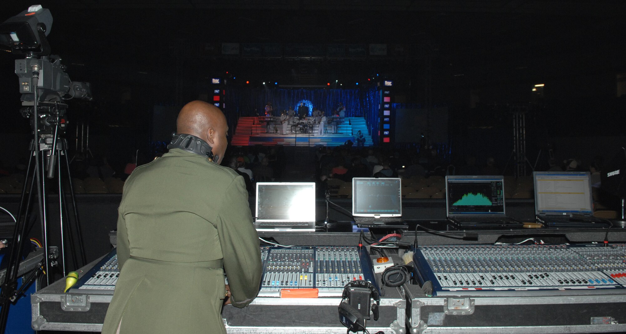 SEDALIA, Mo. – Tech. Sgt. Otis Samuels, Tops in Blue audio director, ensures the audio quality of the Tops in Blue performance Jan. 31. (U.S. Air Force photo/Airman 1st Class Stephen Linch)
