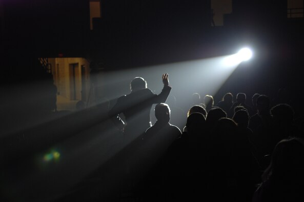 SEDALIA, Mo. – A Tops in Blue performer takes the act from center stage into to the crowd at the Mathewson Exhibition Center at the Missouri State Fairgrounds Jan. 31. (U.S. Air Force photo/Airman 1st Class Stephen Linch)
