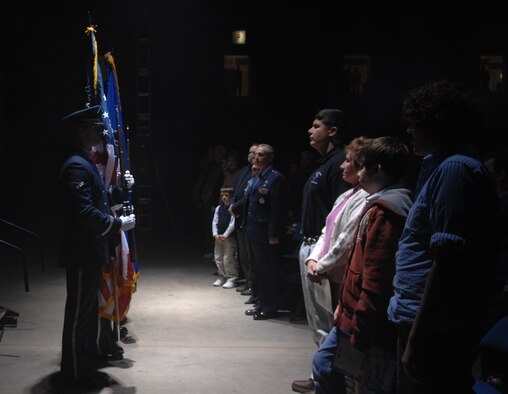 SEDALIA, Mo. – Members of the Whiteman Honor Guard come to a halt in front of center stage before presenting the colors at the premiere entertainment showcase of the U.S. Air Force, the 2007 edition of Tops In Blue musical show entitled "The Fly By" at the Mathewson Exhibition Center at the Missouri State Fairgrounds Jan. 31. Despite the inclement weather many came to see Tops in Blue who tour worldwide each year under the auspices of the Air Force Services Agency located in San Antonio, Texas. (U.S. Air Force photo/Airman 1st Class Stephen Linch)