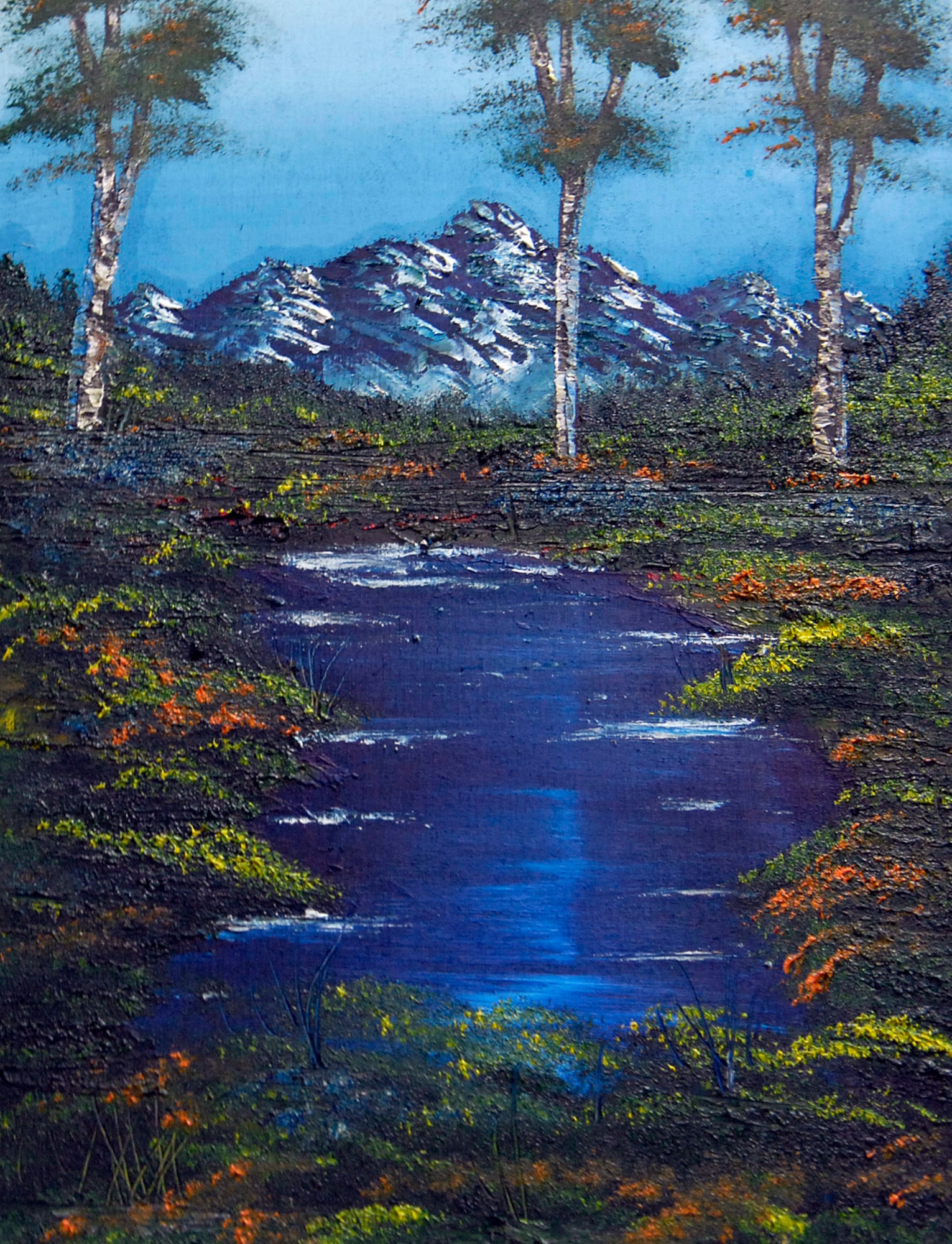 The tranquil scene painted by Tech. Sgt. Robert Sommers was created from leftover wood scraps and will be sold to help pay for heart surgeries for children whose parents are unable to pay for the surgeries themselves. Sergeant Sommers is the 376th Expeditionary Civil Engineer Squadron operations management NCO in charge at Manas Air Base, Kyrgyzstan. (U.S. Air Force photo/Senior Airman Tabitha Kuykendall)