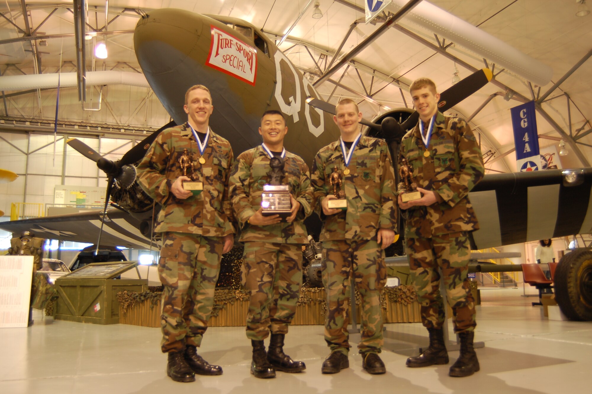 Senior Airman Mark Wolfgang, Master Sgt. Sam Louie, Airman 1st Class Curtis Carnes and Airman 1st Class Daniel Bryant, the 436th Aerial Port Squadron’s team, took first-place honors at the 436th Security Forces Squadron sponsored 9th Annual Ruck March, Feb. 2 at the Air Mobility Museum here. They completed the 6.1 mile course in 1 hour, 59 seconds. (U.S. Air Force photo/Airman 1st Class Shen-Chia Chu)
