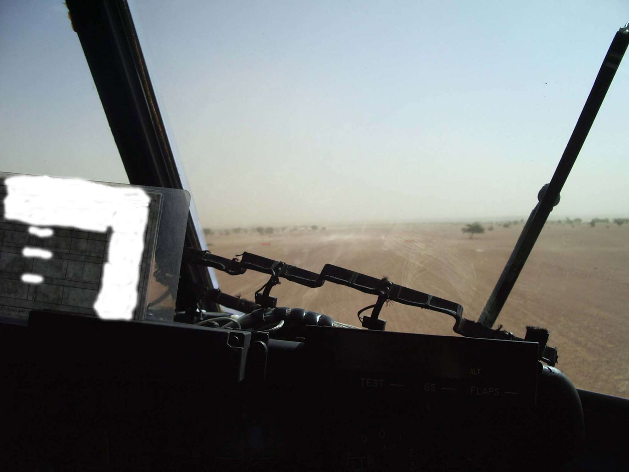 A C-130 Hercules pilot looks over the landing zone prior to takeoff Jan. 28. The operation was a joint mission integrating Army and Air Force assets and deploying these capabilities to the heart of sub-Saharan Africa. (U.S. Air Force photo/Kim Washington)