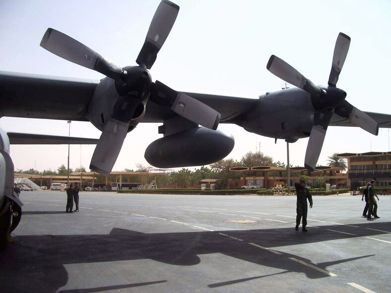 Staff Sgt. Ed Lewis inspects a C-130 Hercules at a forward operating base during a mission Jan. 28 to central Africa. Sergeant Lewis is a 37th Airlift Squadron flight engineer from Ramstein Air Base, Germany.The aircraft utilized by the 37th AS in this mission were C-130E models constructed in 1963 and veterans of nearly every conflict America has faced in the ensuing 45 years. (U.S. Air Force photo/Kim Washington)