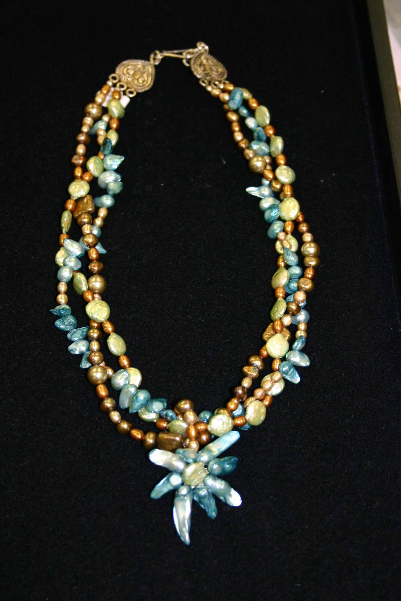 A beautiful, hand-made necklace created by an Alouette bead designer.