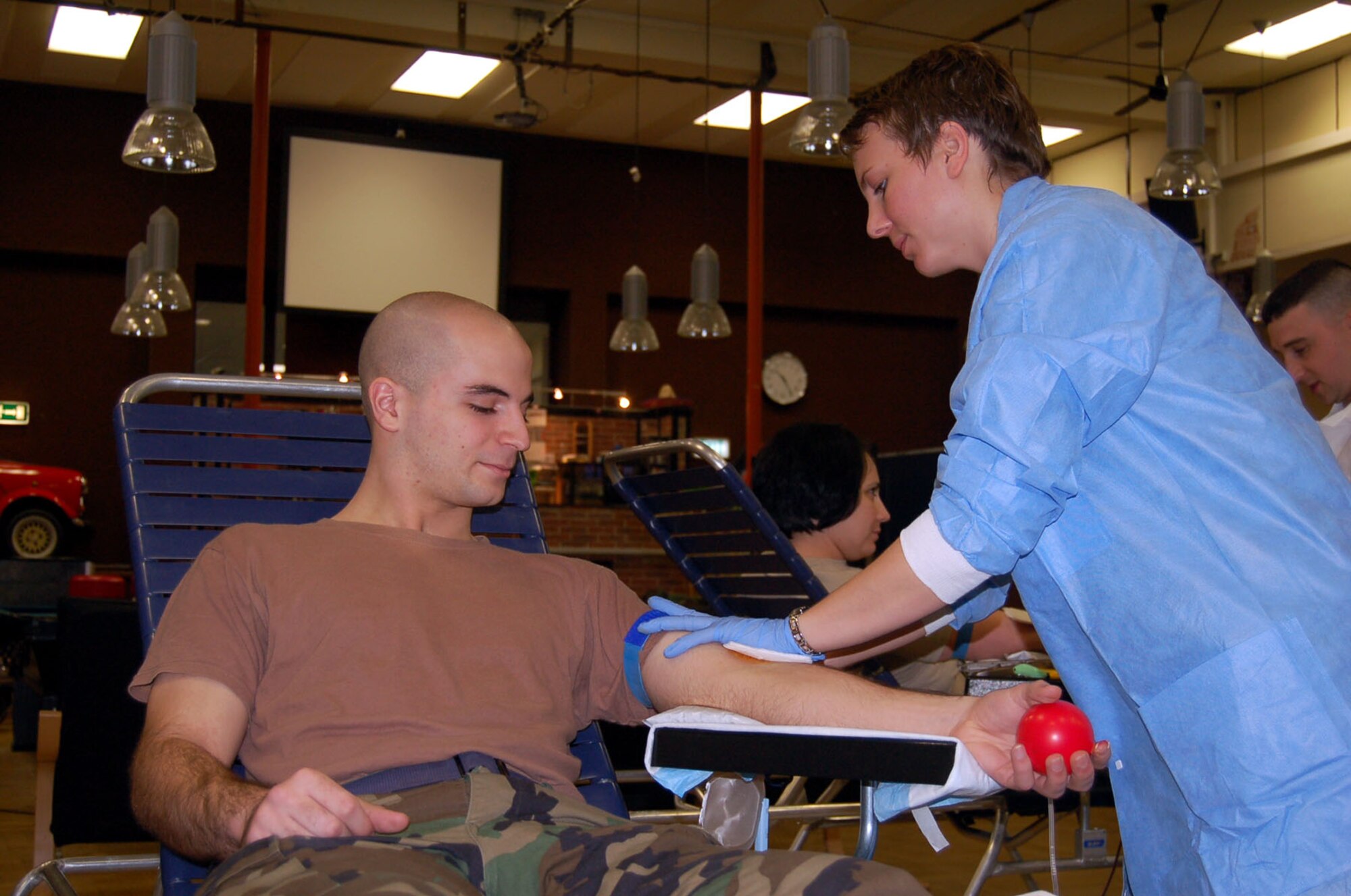 SPANGDAHLEM AIR BASE, Germany – Army Staff Sgt. Ayssa Andre, Landstuhl Regional Medical Center Armed Services Blood Bank Center – Europe, prepares to draw blood from Airman Nicholas Barbieri, 52nd Civil Engineer Squadron, during a base blood drive, Feb. 6, 2008. (U.S. Air Force photo/Staff Sgt. Tammie Moore)
