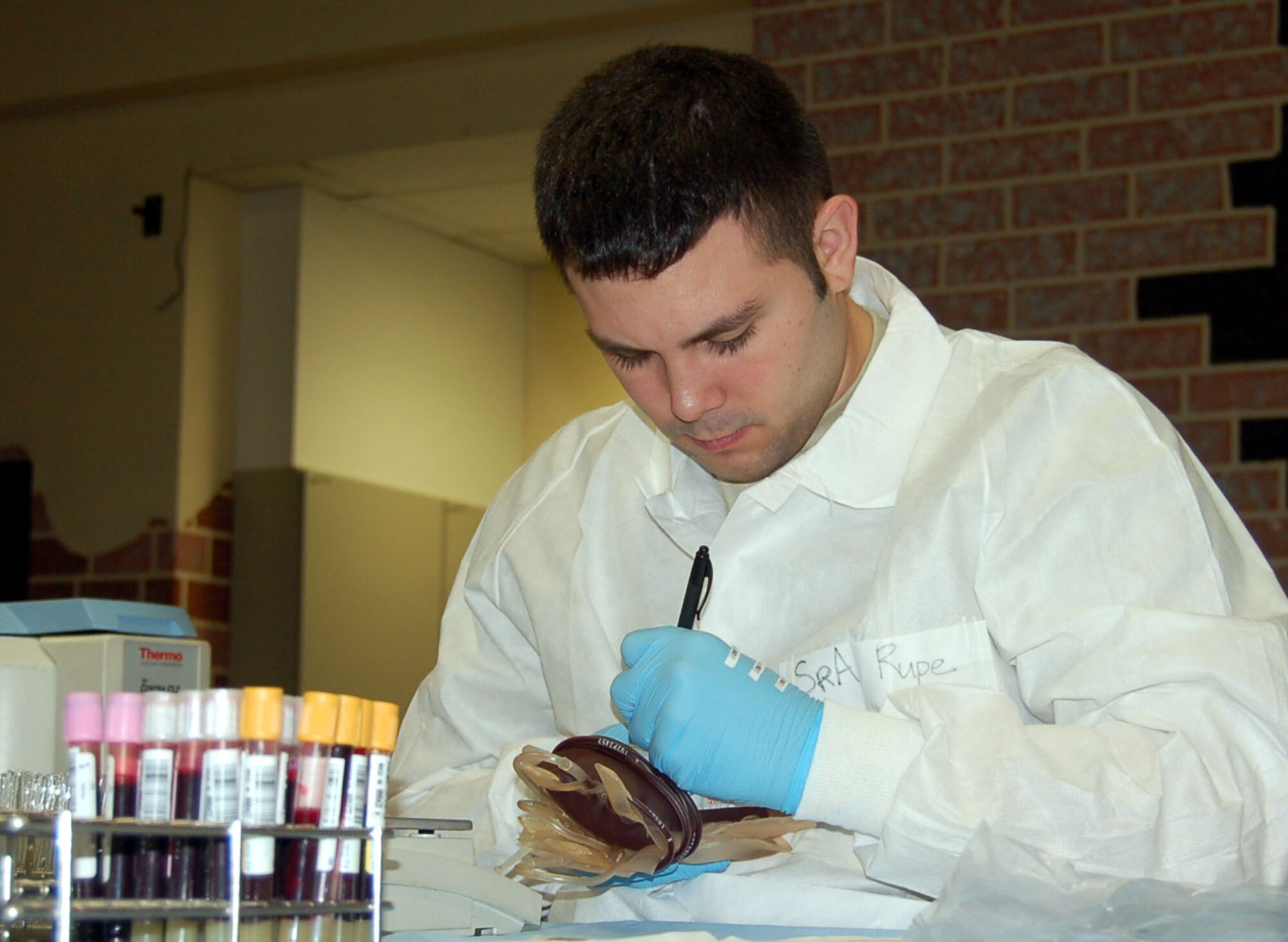 SPANGDAHLEM AIR BASE, Germany – Senior Airman Joseph Rupe, 435th Medical Squadron at Ramstein Air Base, Germany, processes donated blood Feb. 6, 2008. (U.S. Air Force photo/Staff Sgt. Tammie Moore)