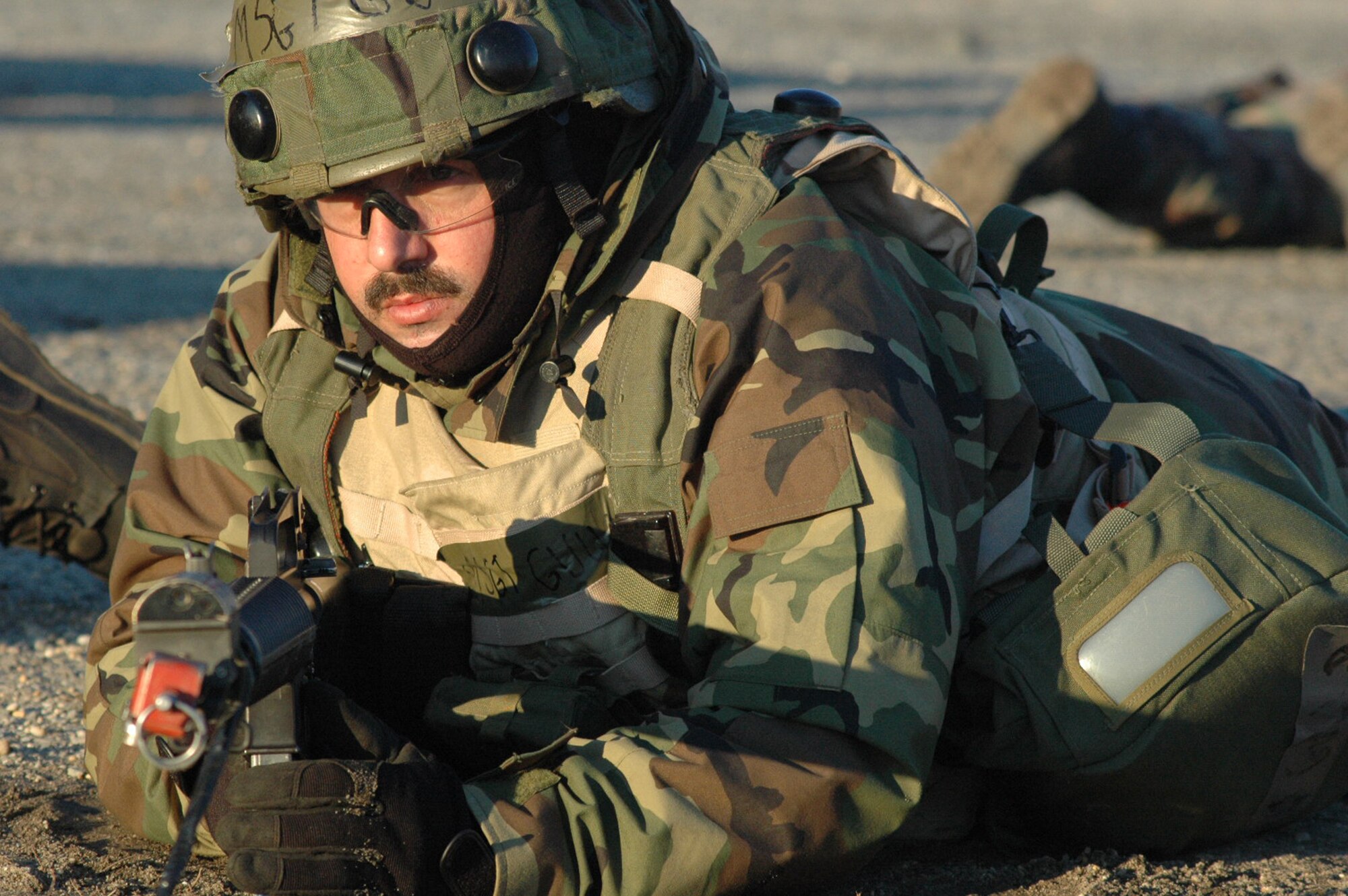 An Airman deployed to Air Force Exercise Eagle Flag 08-2 respond to an opposing forces attack on their camp during a scenario for the exercise Jan. 23, 2008, at Naval Air Engineering Station Lakehurst, N.J.  The exercise is operated by the U.S. Air Force Expeditionary Center's Expeditionary Operations School and the 421st Combat Training Squadron from Fort Dix, N.J.  (U.S. Air Force Photo/Tech. Sgt. Scott T. Sturkol)