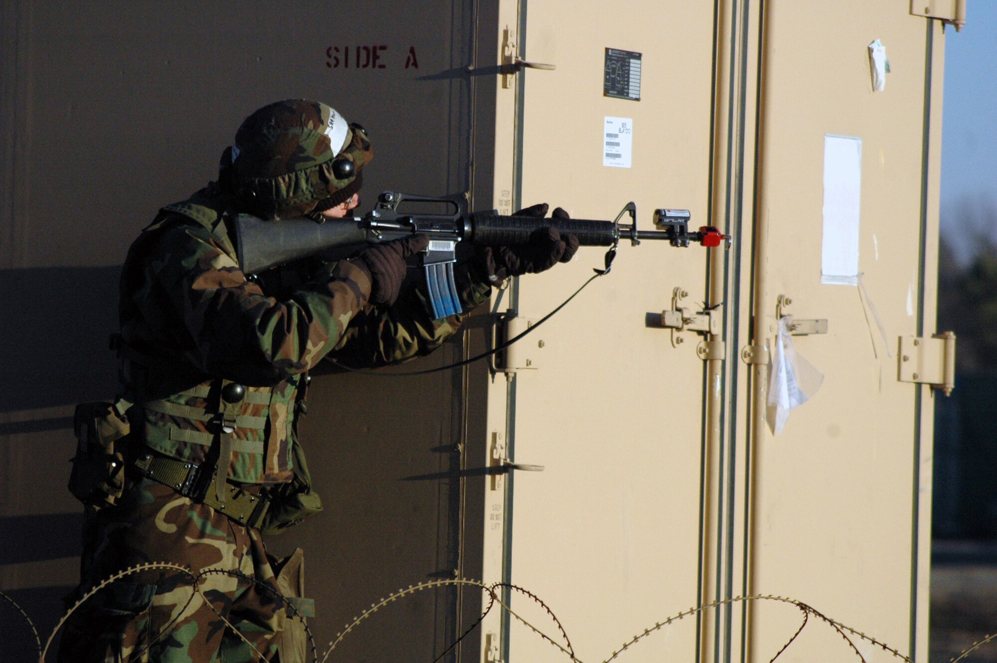An Airman deployed to Air Force Exercise Eagle Flag 08-2 respond to an opposing forces attack on their camp during a scenario for the exercise Jan. 23, 2008, at Naval Air Engineering Station Lakehurst, N.J.  The exercise is operated by the U.S. Air Force Expeditionary Center's Expeditionary Operations School and the 421st Combat Training Squadron from Fort Dix, N.J.  (U.S. Air Force Photo/Tech. Sgt. Scott T. Sturkol)
