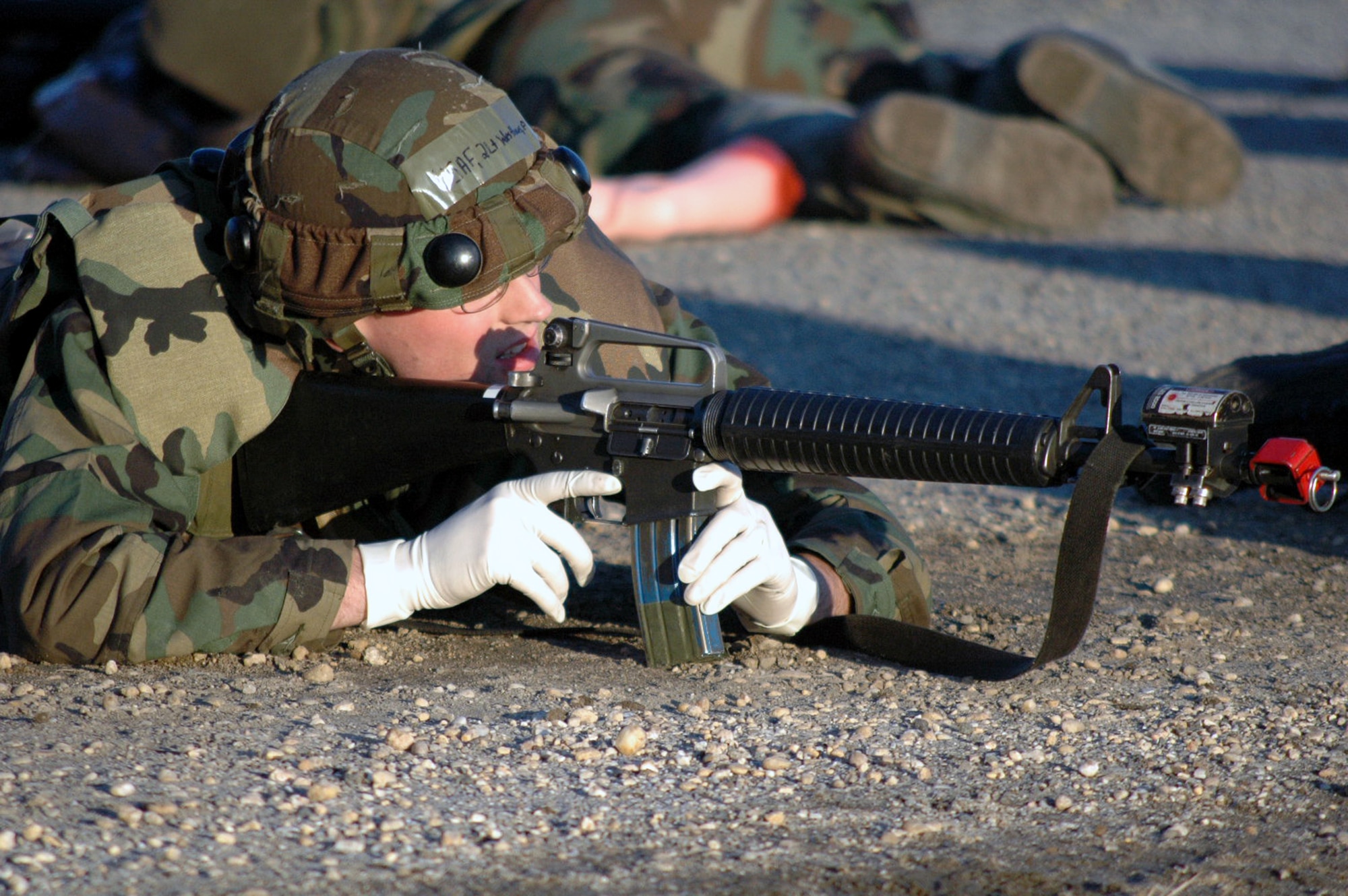 An Airman deployed to Air Force Exercise Eagle Flag 08-2 respond to an opposing forces attack on their camp during a scenario for the exercise Jan. 23, 2008, at Naval Air Engineering Station Lakehurst, N.J.  The exercise is operated by the U.S. Air Force Expeditionary Center's Expeditionary Operations School and the 421st Combat Training Squadron from Fort Dix, N.J.  (U.S. Air Force Photo/Tech. Sgt. Scott T. Sturkol)