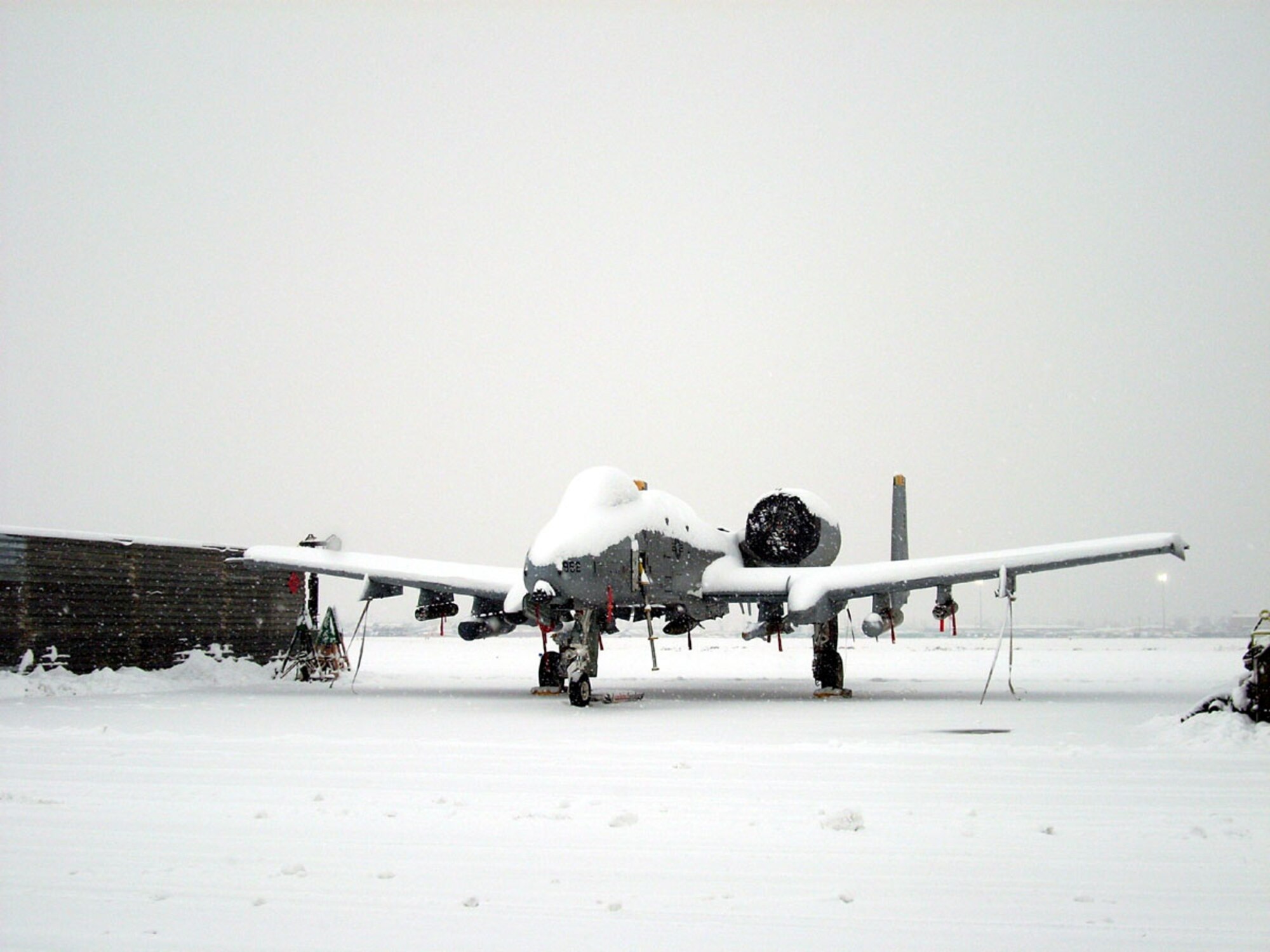 BAGRAM AIR BASE, Afghanistan -- Maintainers from the 81st Expeditionary Aircraft Maintenance Unit work in less than optimal weather conditions here. The maintainers are deployed from the 52nd Aircraft Maintenance Squadron, Spangdahlem AB, Germany. (Courtesy photo)