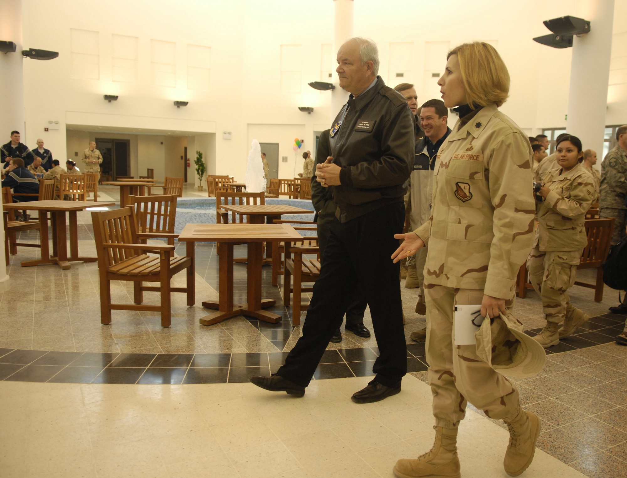 Lt. Col. Susan Ferrera, 379th Expeditionary Services Squadron commander, provides Secretary of the Air Force, Michael W. Wynne a guided tour of the Blatchford-Preston Complex Community Mall during the grand opening festivities here.  The Community Mall houses a base exchange, recreation center, game room, theater, movie rooms, post office, and Learning Resource Center. (U.S. Air Force photo/Master Sgt. Andy Dunaway)

