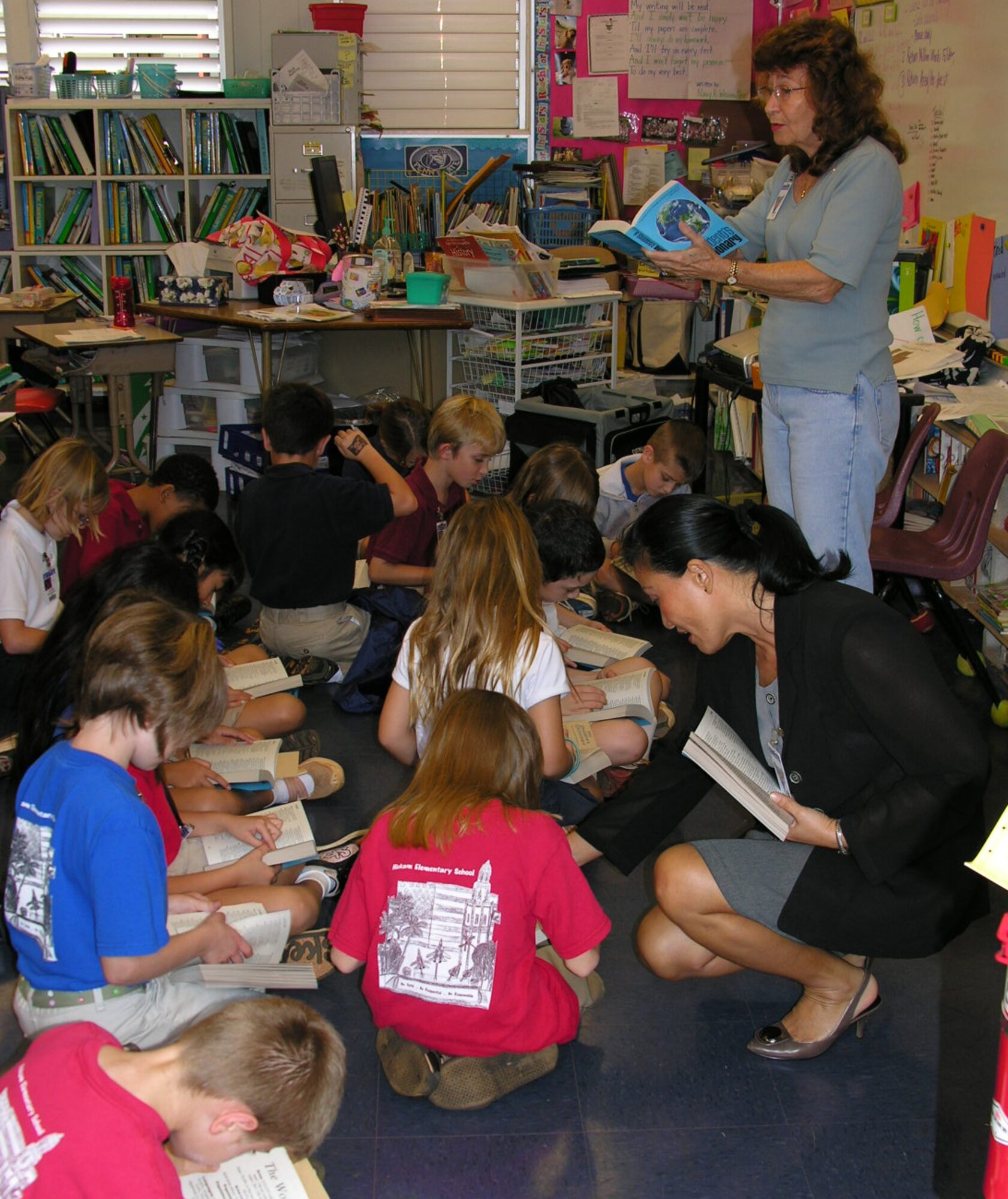 After copies of the dictionary were being handed out to 3rd graders of Hickam Elementary School, members of rotarians guided students to look up some words for definitioin.  