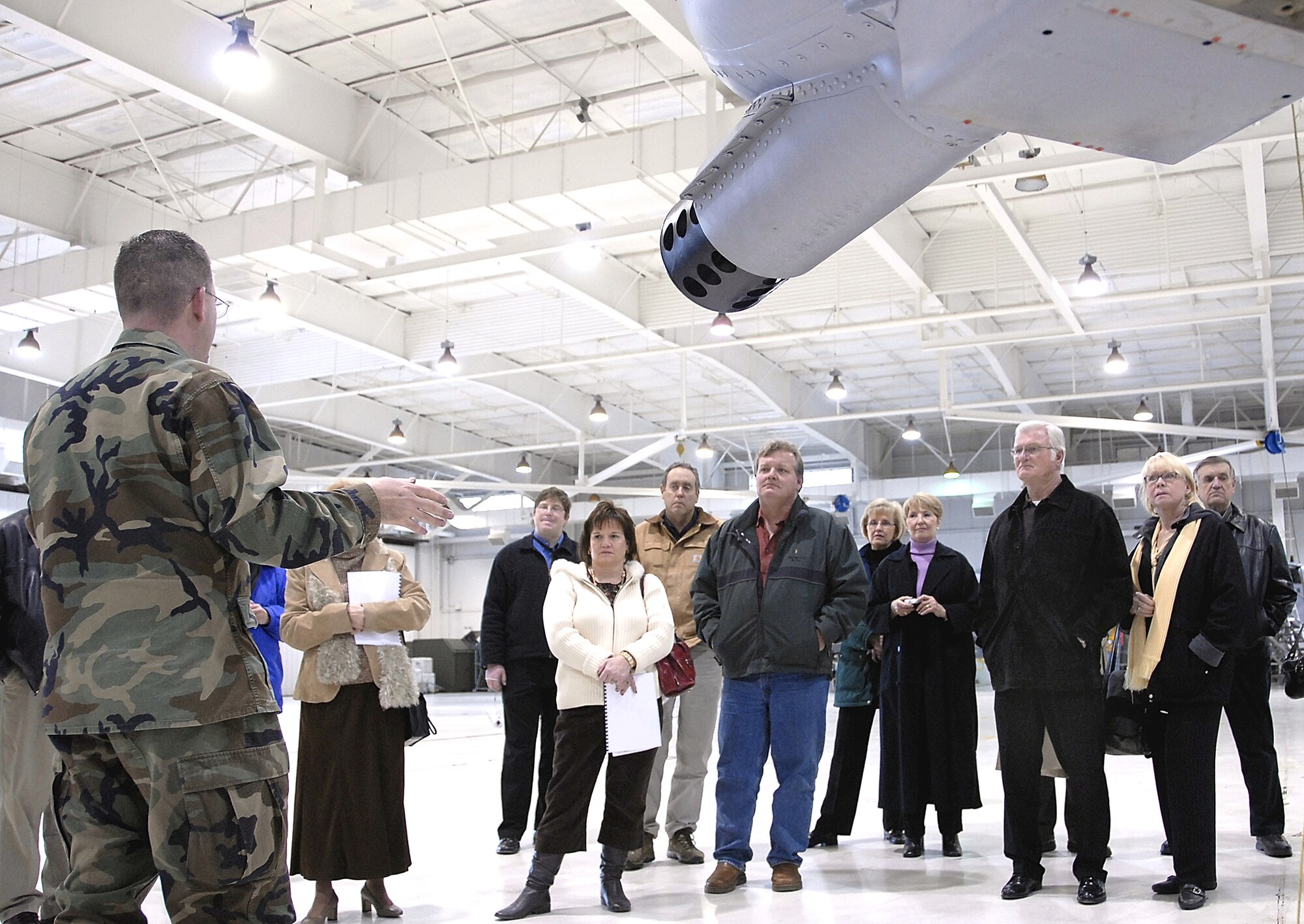 With the resumption of the Whiteman Air Force Base, Mo., public tour season, Maj. David Kurle, 442nd Fighter Wing Public Affairs officer, talks about the characteristics of the wing's A-10 Thunderbolt II aircraft with members of the Whiteman Base Community Council, a military support organization comprised of civic leaders and volunteers from communities in west central Missouri. The 442nd FW is an Air Force Reserve Command unit with more than 1,000 reservists assigned. (US Air Force photo/Master Sgt. Bill Huntington)
