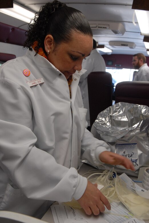VANDENBERG AIR FORCE BASE, Calif. -- Janel Stewart, a donor care specialist with United Blood Services, prepares blood bags on Feb. 6. Forty-three people volunteered to donate a pint of blood to the United Blood Services. The blood is used to treat patients in such instances as open heart surgery, hip replacement, women giving birth, and cancer patients. United Blood Services Central Coast covers Ventura to Salinas and must acquire a minimum of 275 units a day to operate effectively.  (U.S Air Force photo by Airman 1st Class Stephanie Longoria)
