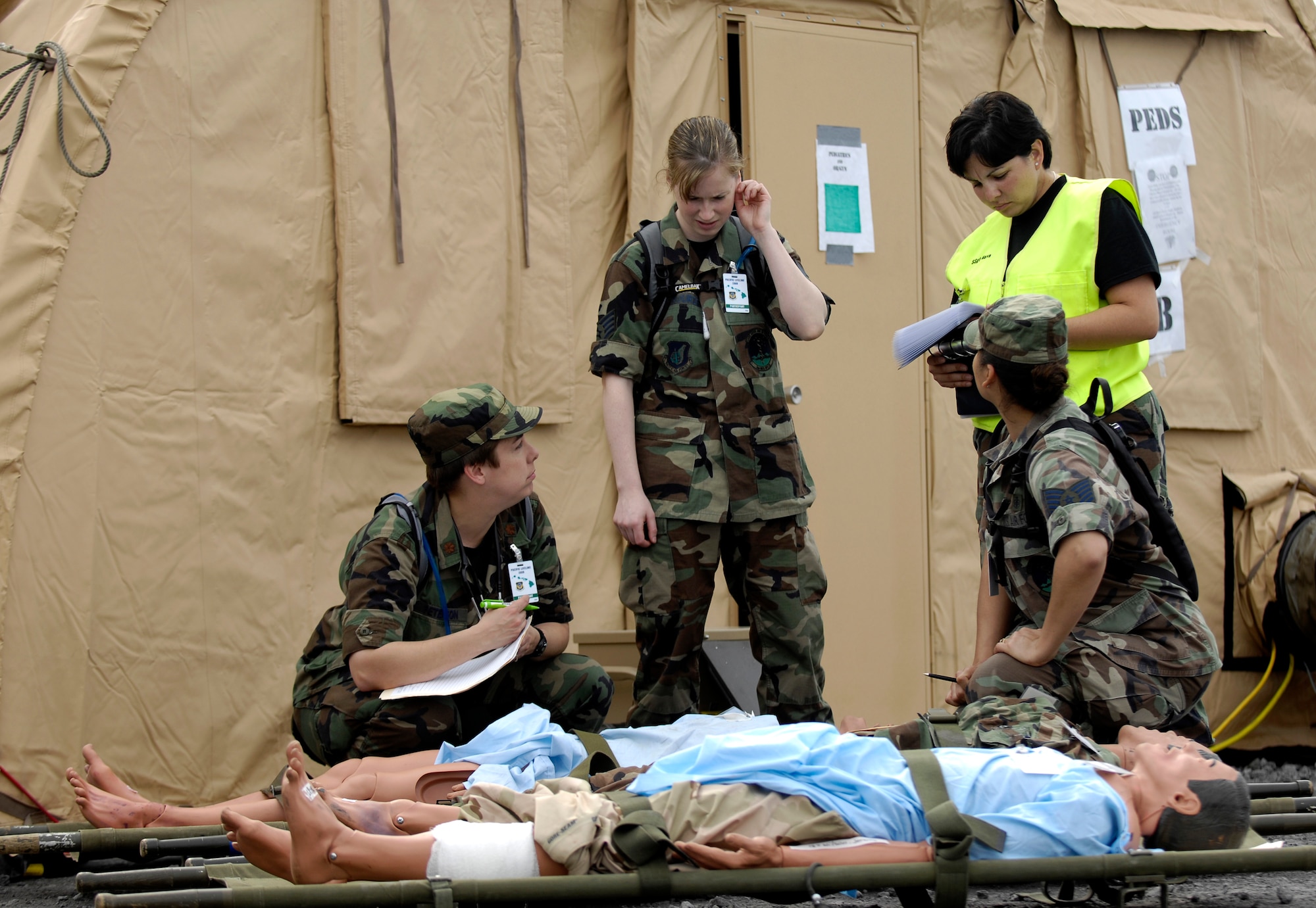 Medical personnel run through a patient scenario Feb. 5, 2008 during Exercise Pacific Lifeline at Kona International Airport, Hawaii. Pacific Lifeline is a total force exercise staging from three locations within the Hawaiian Islands. It provides approximately 900 Department of Defense personnel a test environment to rapidly deploy and provide time-critical services  in the wake of a simulated natural disaster. (U.S. Air Force photo/Tech. Sgt. Shane A. Cuomo)