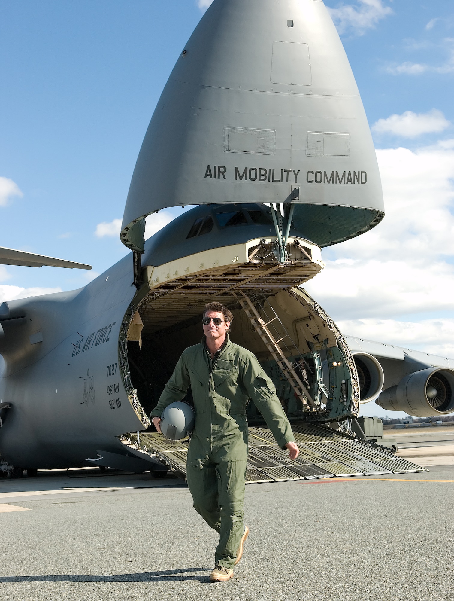 Ty Pennington, host of ‘Extreme Makeover: Home Edition,’ walks past one of Dover Air Force Base’s C-5 Galaxys during the filming of an introduction to the show Feb. 7. The episode is scheduled to air March 30. (U.S. Air Force photo/Jason Minto)