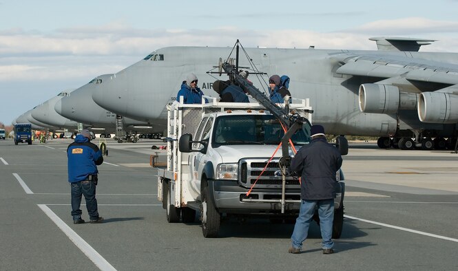 An ‘Extreme Makeover: Home Edition’ film crew readies their camera equipment for a shot of Dover Air Force Base’s flightline. The crew visited Dover AFB Feb. 7 to film the introduction for an upcoming episode, scheduled to air March 30. (U.S. Air Force photo/Jason Minto)