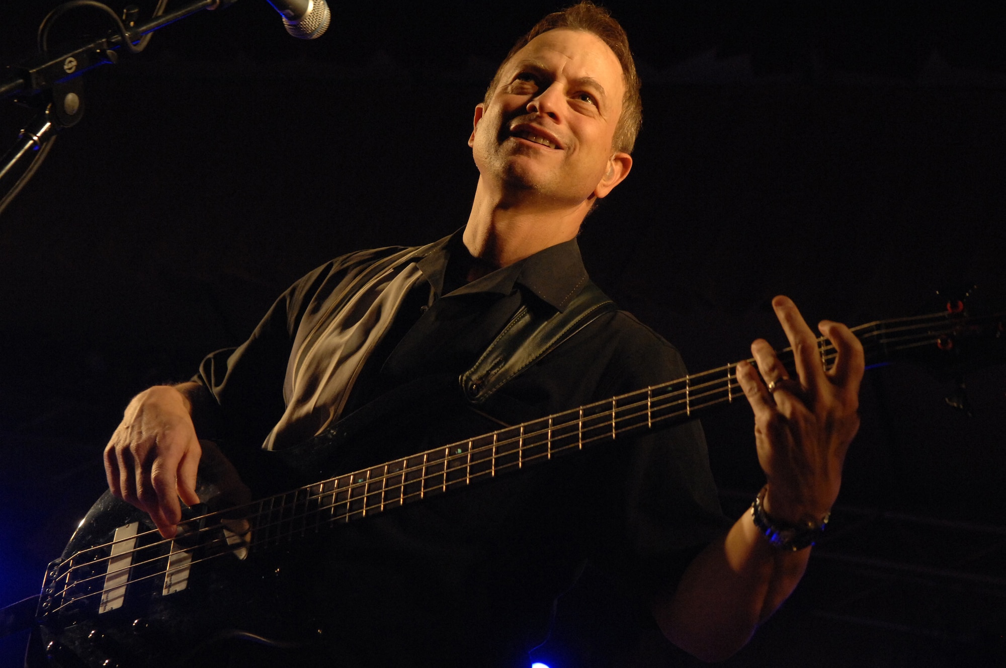 Gary Sinise of the Lt. Dan Band plays the bass for the United Service Organizations entertainment tour at Ellsworth Air Force Base, S.D., Feb. 1, 2008. The private concert for Ellsworth Airmen and their families is the first this year in the series of stateside USO tours. (U.S. Air Force photo/Airman 1st Class Joshua Seybert) 
