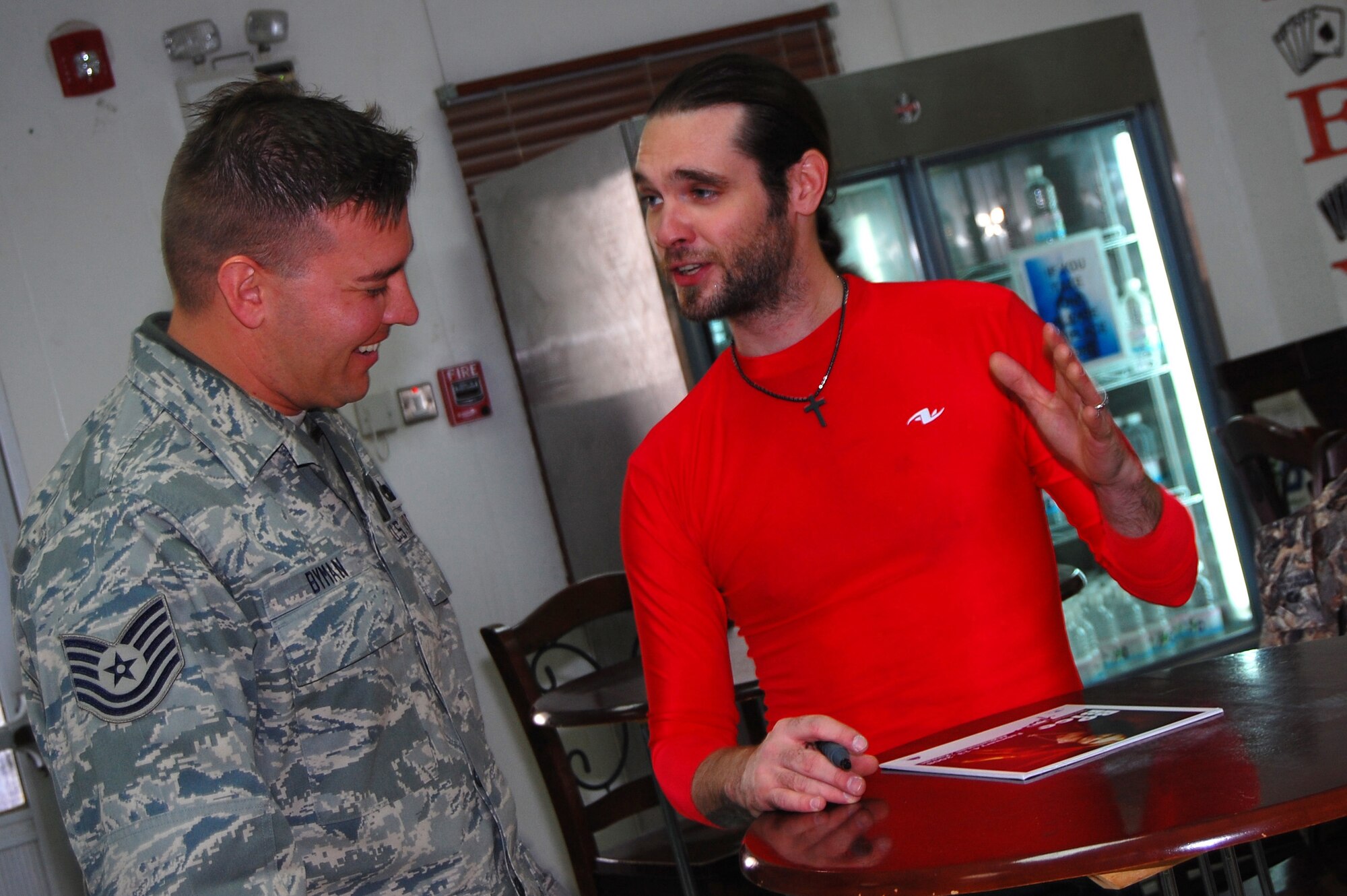 SOUTHWEST ASIA -- American singer and musician Harold Elwin “Bo” Bice Jr. speaks with Tech. Sgt. Raymond Byman, 386th Expeditionary Logistics Readiness Squadron, Feb. 7, 2008, at an air base in the Persian Gulf Region. Bo Bice is visiting servicemembers deployed to Southwest Asia in support of Operations Enduring and Iraqi Freedom during his Stars for Stripes tour. Sergeant Byman is deployed from the Joint Personal Property Shipping Office in Colorado Springs, Colo. (U.S. Air Force photo/ Staff Sergeant Patrick Dixon)