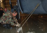 MOODY AIR FOCE BASE, Ga -- Tech. Sgt. Roy Nickel, 723rd Aircraft Maintenance Squadron HH-60G Pave Hawk crew chief, is mooring an HH-60G Pave Hawk inside a C-5 Galaxy here Feb. 6.  The aircraft is being transported to Balad Air Base, Iraq in support of Operation Iraqi Freedom. (U.S. Air Force photo by Senior Airmen Schelli Jones)