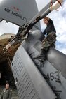 MOODY AIR FORCE BASE, Ga. — Airman 1st Class Joshua Allen, 723rd Aircraft Maintenance Squadron HH-60G Pave Hawk hydraulic technician, ensures the tail rotor of the search and rescue helicopter is properly positioned before loading onto a C-5 Galaxy here Feb 6.  The helicopter is designed to fold quickly for ease of shipment in aircraft such as the C-5. and C-17 Globemaster II (U.S. Air Force photo by Senior Airman Angelita Lawrence)