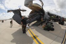 MOODY AIR FORCE BASE, Ga. — Members of the 723rd Aircraft Maintenance Squadron guide an HH-60G Pave Hawk helicopter onto a Dover AFB, Del. based C-5 Galaxy Feb. 6.  The large transport aircraft has the capacity to carry up to five of the search and rescue helicopters. (U.S. Air Force photo by Senior Airman Angelita Lawrence)