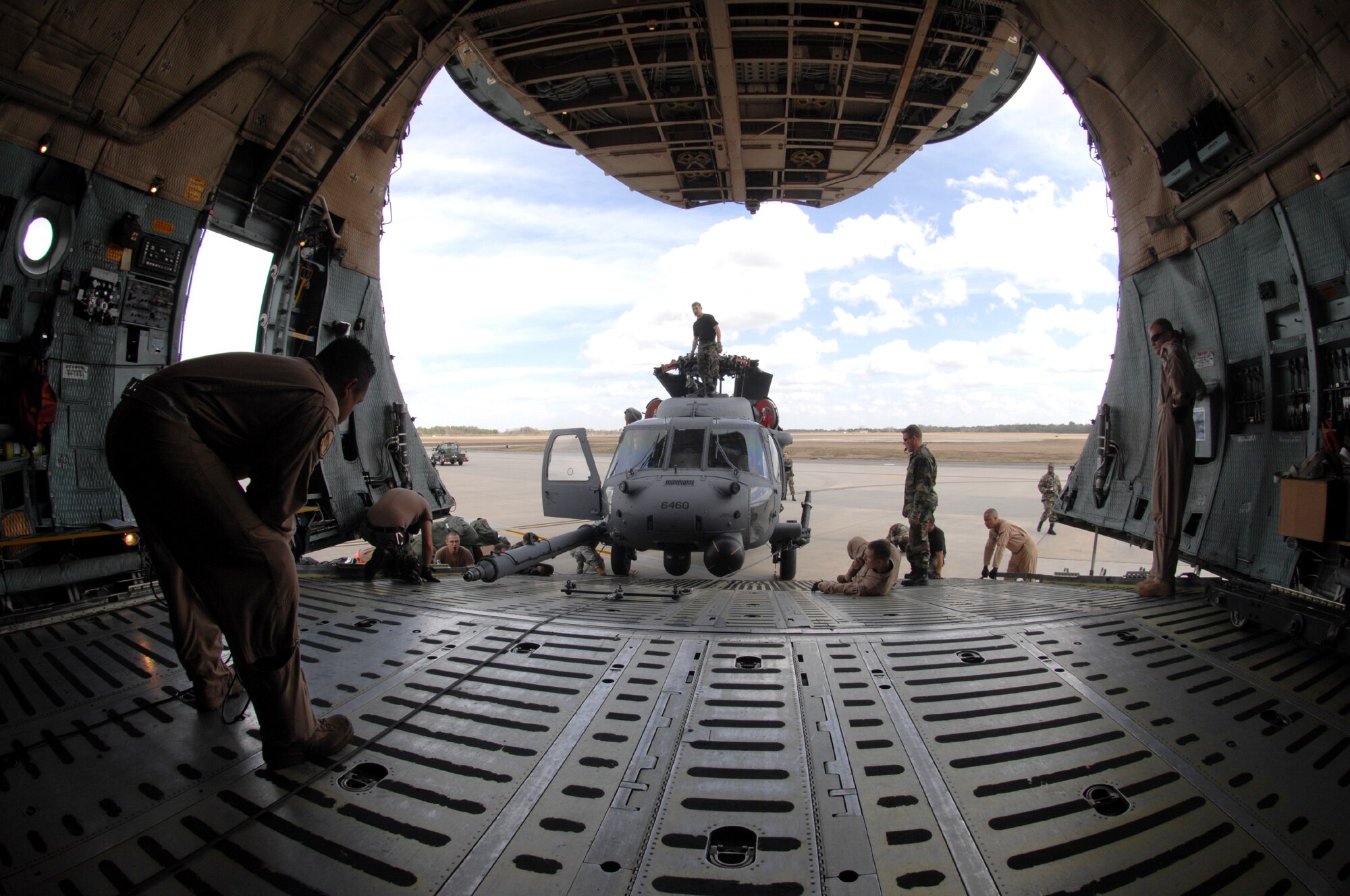 MOODY AIR FORCE BASE, Ga. — Members of Moody’s 723rd Aircraft Maintenance Squadron assist a C-5 Galaxy crew from Dover Air Force Base, Del. with loading an HH-60G Pave Hawk combat search and rescue helicopter here Feb. 6.  The aircraft is one of two being transported from Moody to Balad Air Base, Iraq, in support of Operation Iraqi Freedom. (U.S. Air Force photo by Senior Airman Angelita Lawrence)