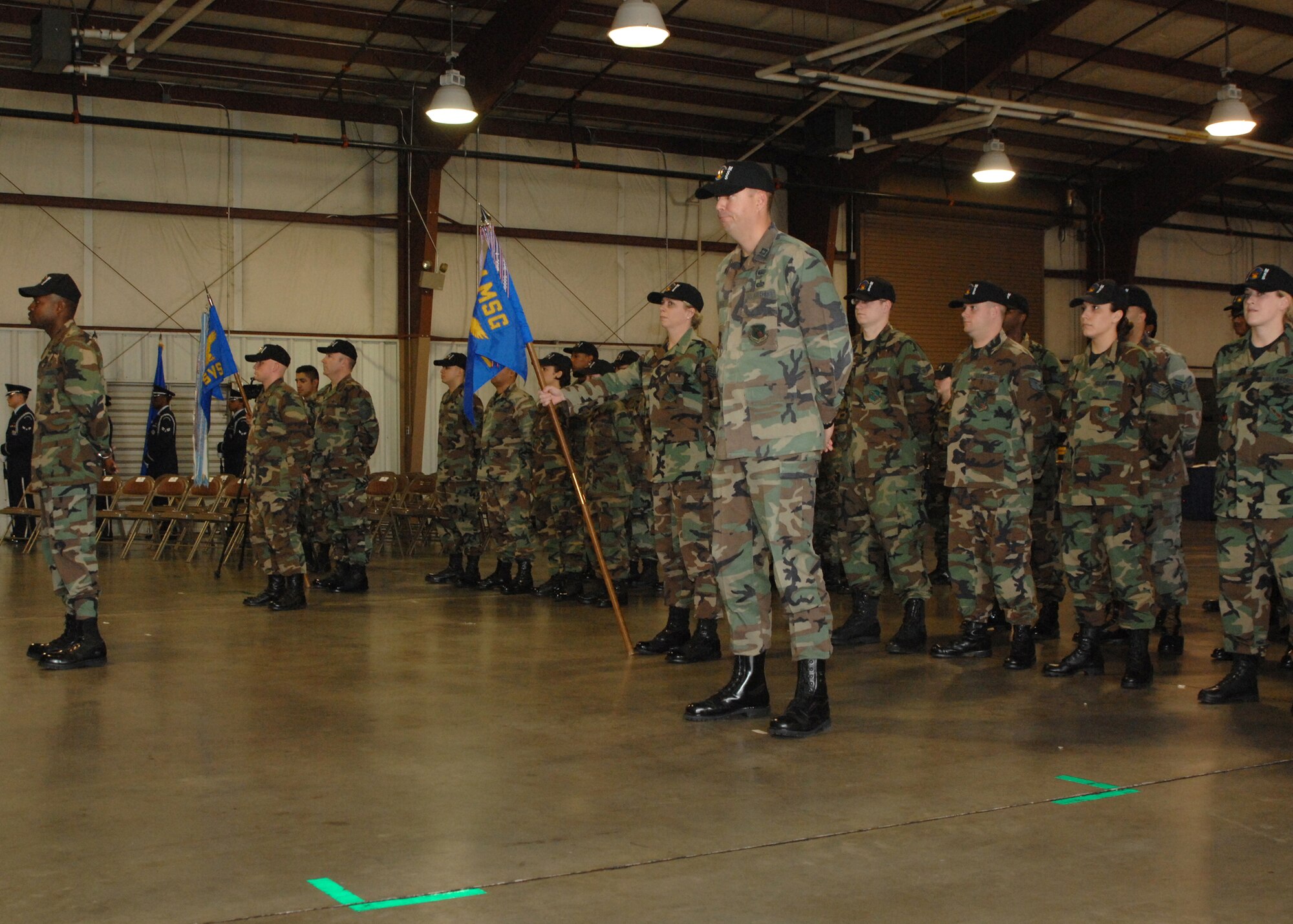 Members of the 4th Services Squadron as and the 4th Mission Support Squadron, stand at ease while waiting for the activation of the 4th Force Support Squadron, on February 4, 2008 at Seymour Johnson Air Force Base, Goldsboro, North Carolina. The 4th Force Support Squadron is one of many mergers to take place Air Force wide within the future. (U.S, Air Force photo by Airman First Class Jonathon Williams)(released)