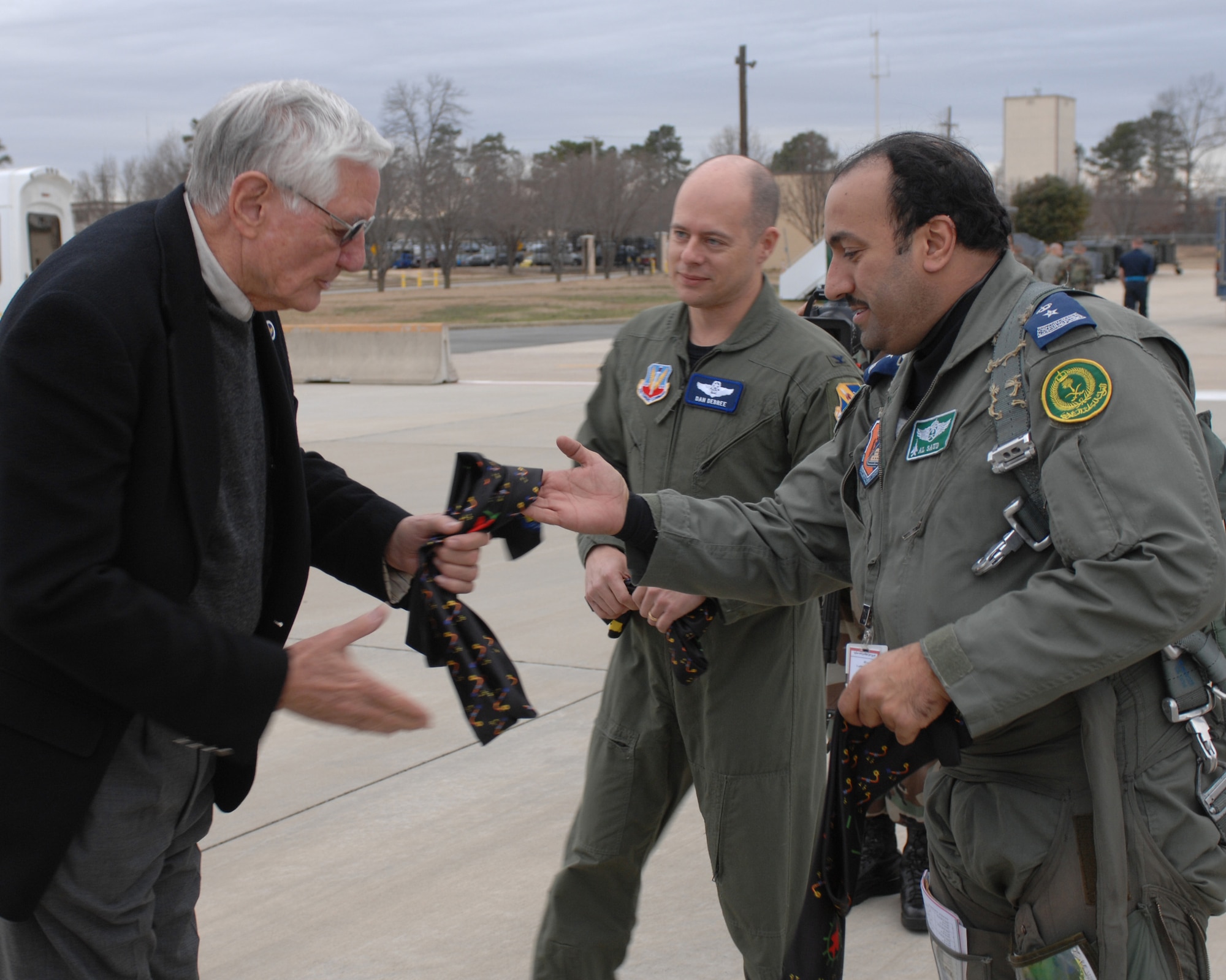 Mr. Troy Pate, chairman of the Seymour Support Council greets (Prince(Lieutenant Colonel) Abdullah A Al Saud Turki after he and other Saudi pilots land for a stop over at Seymour Johnson AFB, enroute to Nellis AFB, Nevada. January 31, 2008.(US Air Force photo by Airmen First Class Ciara Wymbs