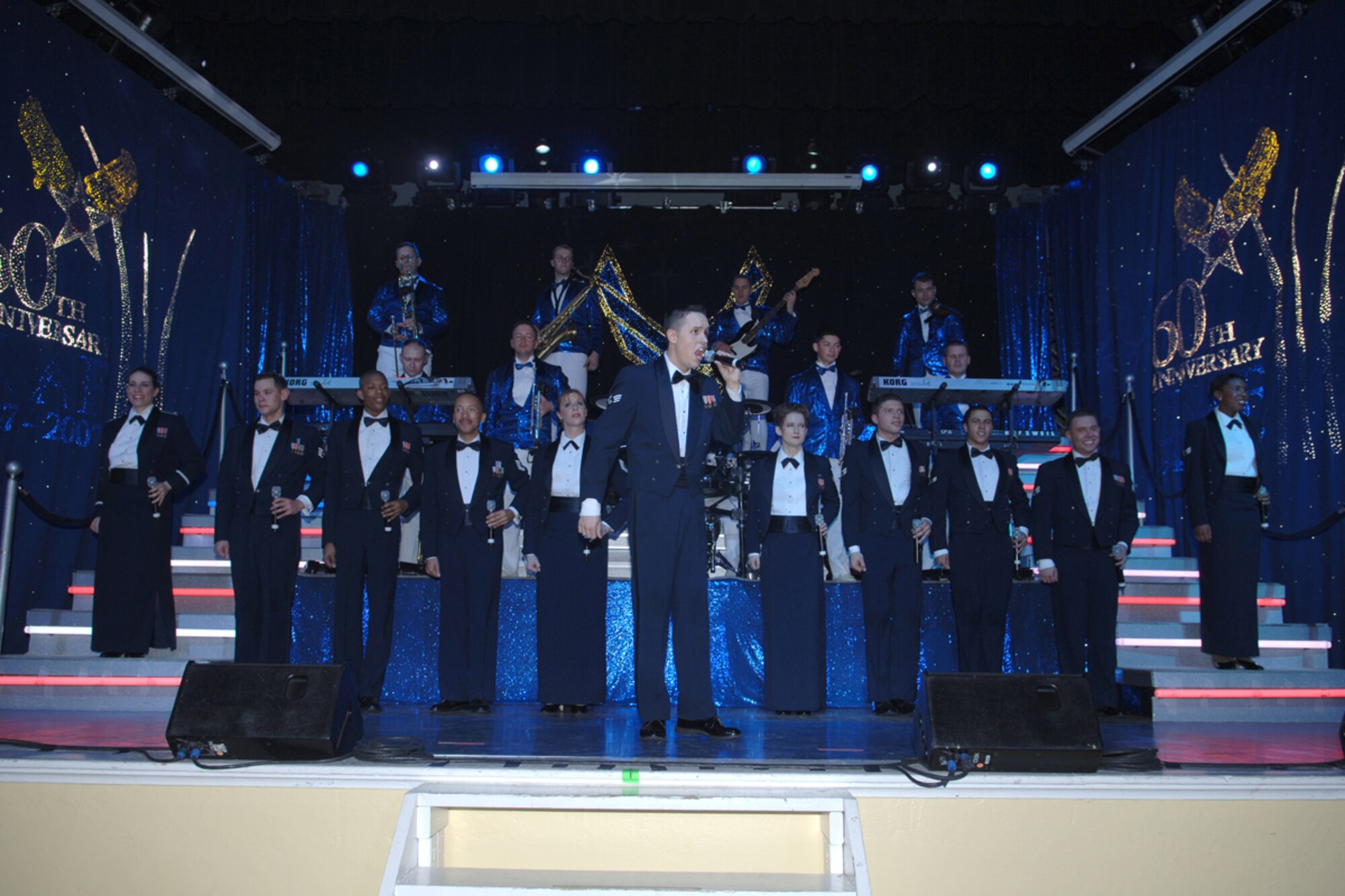 The Tops in Blue performers sing one last song during their performance Monday night. The Tops in Blue performed for the BLAZE Team and the local community. (U.S. Air Force photo by Elizabeth Owens)