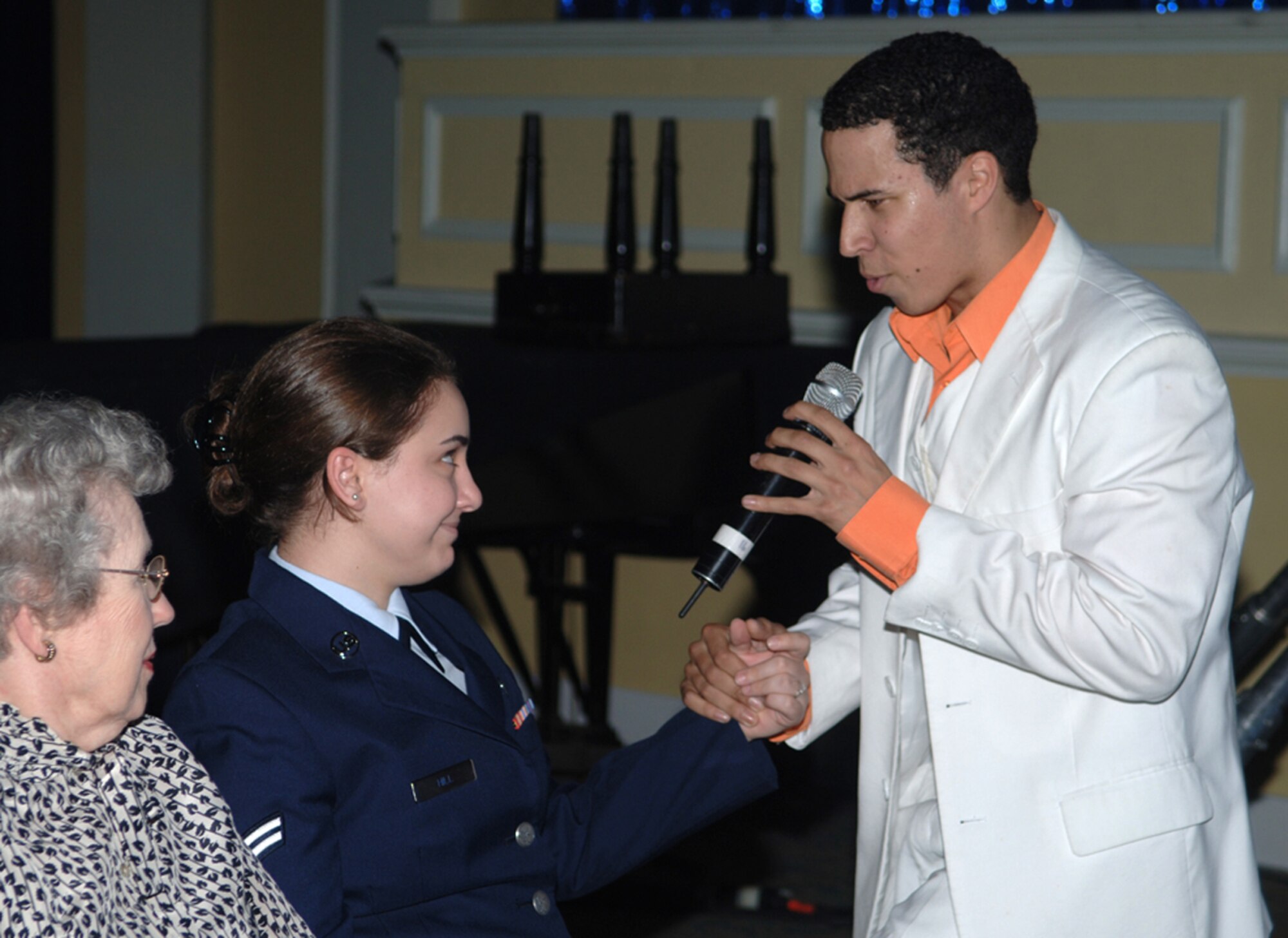 Airman 1st Class Jesse Cox sings to Airman 1st Class Danielle Hill, 14th Flying Training Wing Public Affairs, during the Tops in Blue performance Monday night. The performers sang and  danced with members of the audience. (U.S. Air Force photo by Elizabeth Owens)