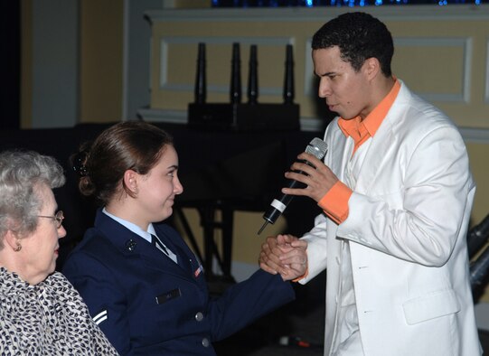 Airman 1st Class Jesse Cox sings to Airman 1st Class Danielle Hill, 14th Flying Training Wing Public Affairs, during the Tops in Blue performance Monday night. The performers sang and  danced with members of the audience. (U.S. Air Force photo by Elizabeth Owens)