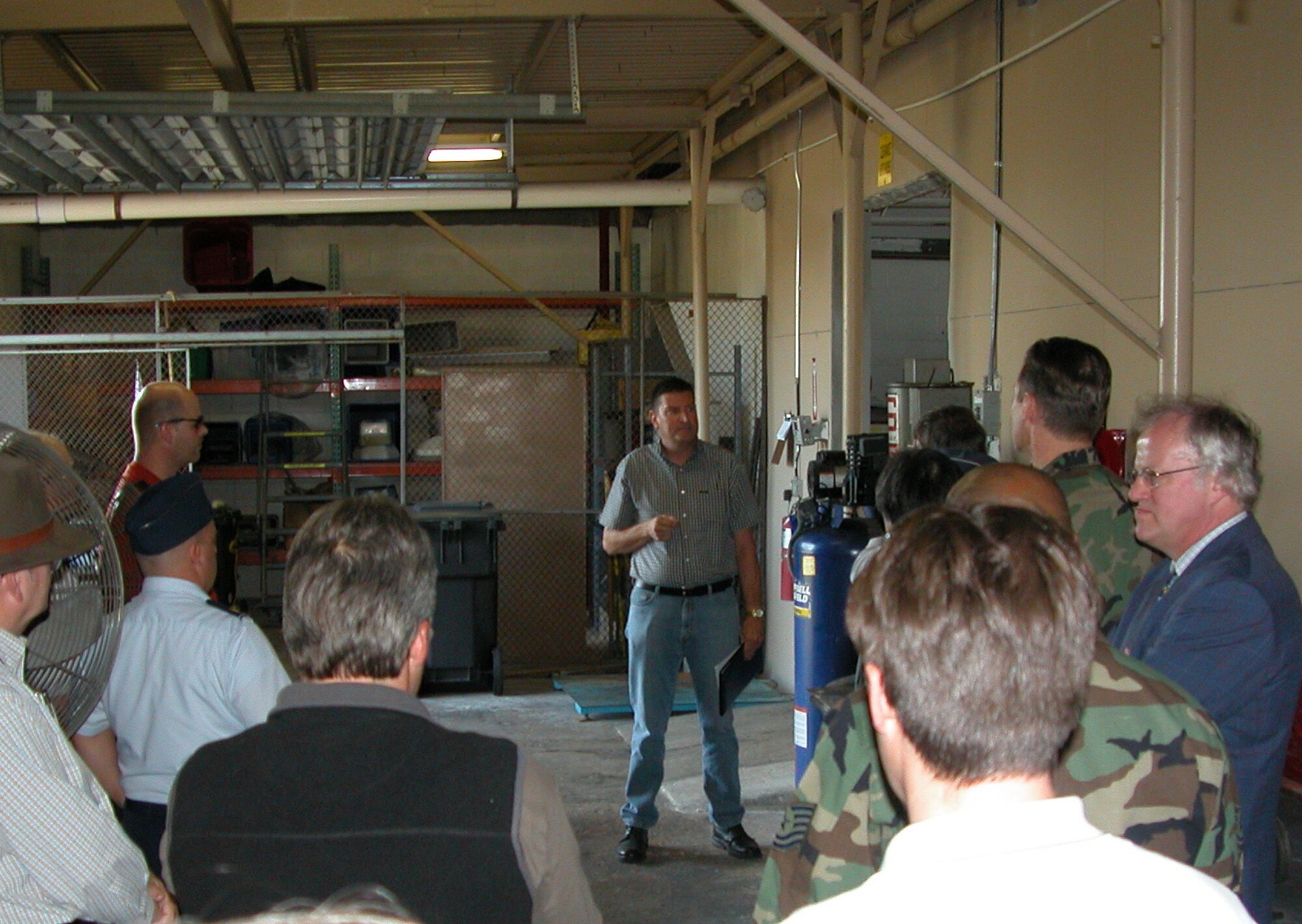 Tim Driscoll (center), 482nd Mission Support Group Environmental Flight, explains the workings of the Base Recycling Center during the F-16 Environmental Working Group conference from Jan. 29-31. The conference addressed emerging environmental and maintenance issues revolving around the F-16 weapon system (U.S. Air Force photo/Anthony Cedeno)