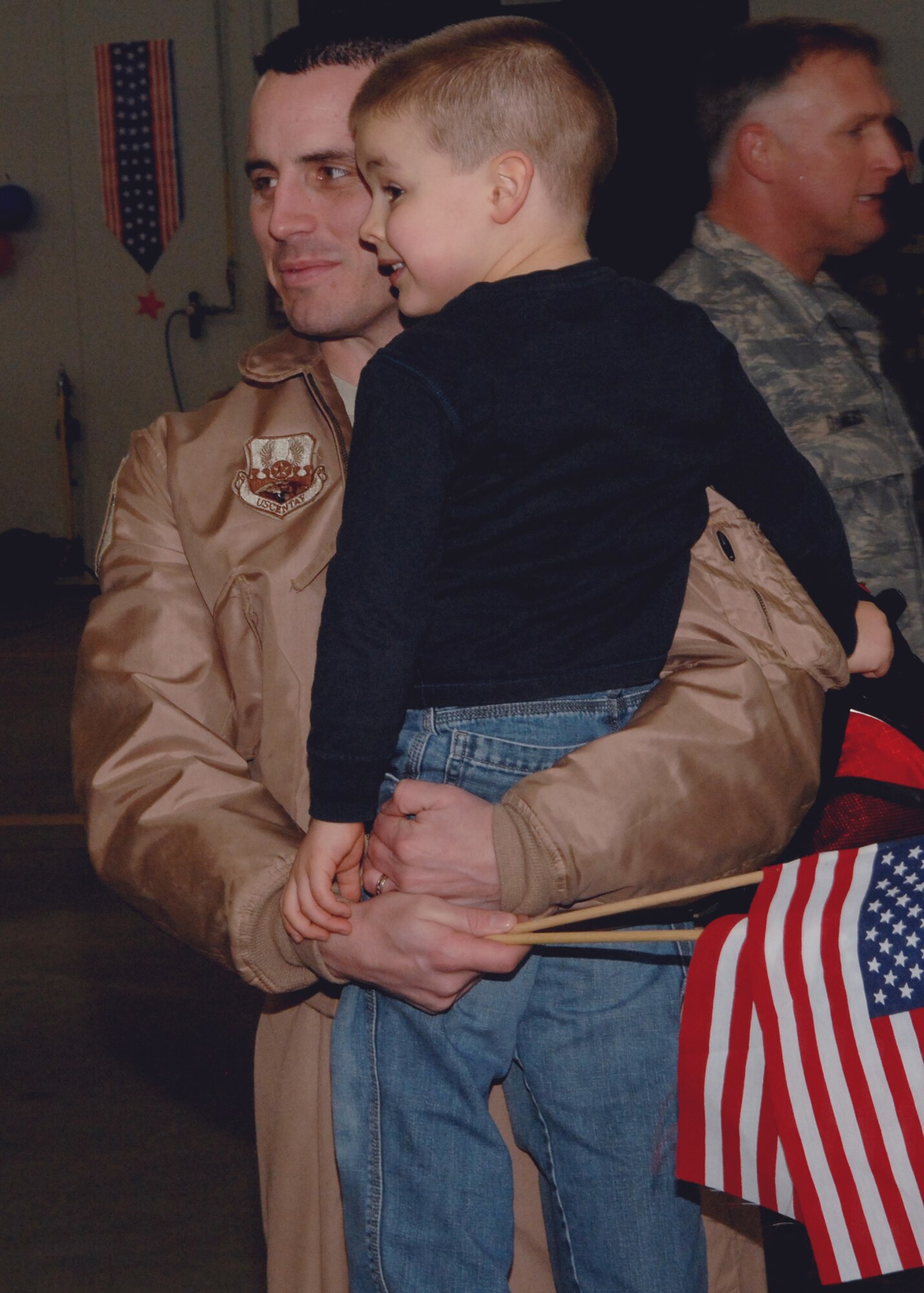 SPANGDAHLEM AIR BASE, Germany – Capt. Nick Walker, 52nd Fighter Squadron, holds his son, Markus, after returning from a deployment in support of Operation Iraqi Freedom Feb. 6, 2008. (U.S. Air Force photo/Senior Airman Logan Tuttle)