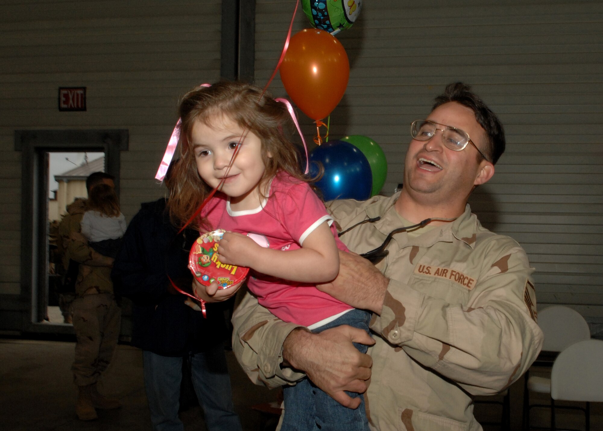 SPANGDAHLEM AIR BASE, Germany – Master Sgt. Ramon Gutierrez, 52nd Aircraft Maintenance Squadron, holds his daughter, Katharine, after returning from a deployment in support of Operation Iraqi Freedom Feb. 6, 2008. (U.S. Air Force photo/Senior Airman Logan Tuttle)